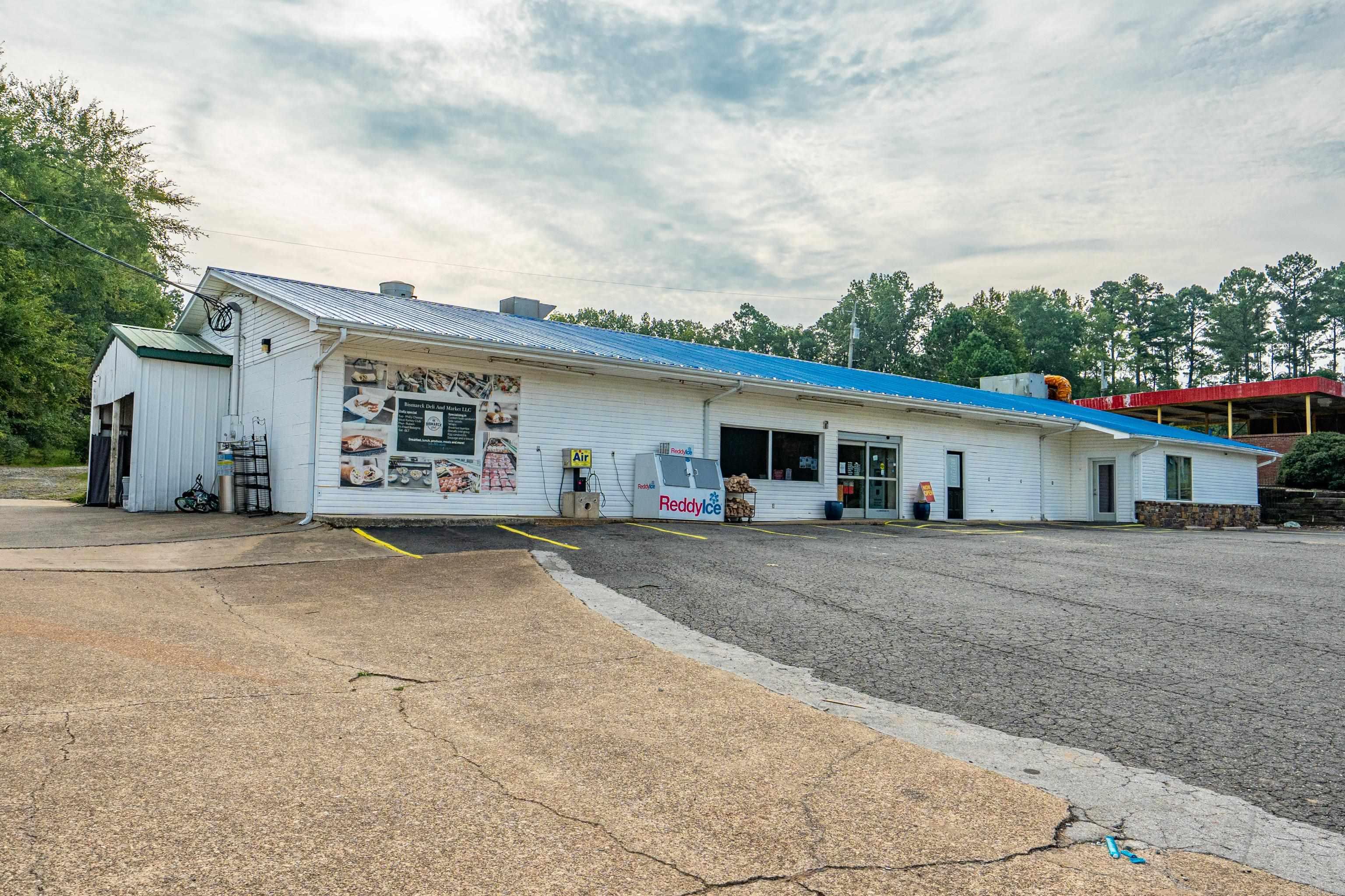 Here’s your chance to own a well-known Charming Hometown Deli deli in a prime location with excellent visibility right on the main thoroughfare. The property offers endless potential with several leasing opportunities, or you can make full use of the entire building to suit your business needs. With plenty of parking and unbeatable frontage, this property is a rare find for anyone looking to invest in a versatile business hub in the heart of town. The 3 businesses share water and electric. Seller is not selling the business but would be willing to allow all equipment, tables and chairs, fridge coolers, oven etc with right priced offer. Soda machine is rented SEE AGENT REMARKS