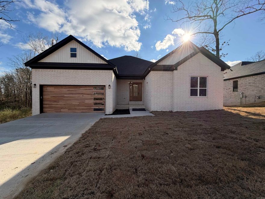 Stunning new construction in a beautiful subdivision just 1.7 miles from Lakeside School! This full-brick home offers 2,570 sq ft of heated/cooled space with 4bedrooms with walk in closets for each one, and 2.5 baths. The open layout features 10’ ceilings, luxury vinyl flooring, and an electric fireplace. The kitchen is a showstopper with granite countertops, custom cabinets, a walk-in pantry, and stainless appliances. The primary suite includes a large walk-in closet with built-in dressers, soaker tub, and tiled walk in shower. Enjoy the front and back porches with tongue and groove ceilings, plus a rear deck ideal for entertaining. Additional highlights: oversized laundry room with butcher block counters, insulated windows/doors, central electric HVAC, and a gas tankless water heater. This home blends style, comfort, and quality in a prime location.