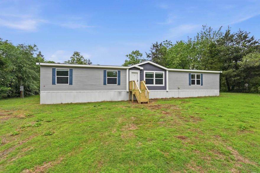 Welcome to this spacious and beautifully updated 5-bedroom, 3-bathroom home offering approximately 2,160 square feet of comfortable living space, perfectly situated on a full 1-acre lot. This home features a thoughtfully designed layout with generous living areas, ideal for both everyday living and entertaining. Recent updates throughout provide a fresh, modern feel while maintaining warmth and functionality. The large kitchen offers ample cabinetry and workspace, flowing seamlessly into the main living areas. Each bedroom is well-sized, with the primary suite offering a private retreat complete with its own full bath. Step outside and enjoy the privacy and space that comes with a full acre—perfect for outdoor activities, gardening, or simply relaxing in a peaceful setting.