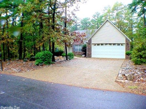 Charming brick-faced 3 bedroom 2 full bath home. Centrally located in private lovely neighborhood inside the gates of Hot Springs Village AR... Beautiful mature wooded landscape. Oversized 2 car garage with extra storage. Move in ready. Washer, dryer and refirg remain. Heat Pump and hot water heater recently replaced. Buyer is encouraged to have the property inspected at his own expense. Seller will bay $0. Inspection and repair. Home is sold As-is-Where-is. Ownership of this property includes access to A