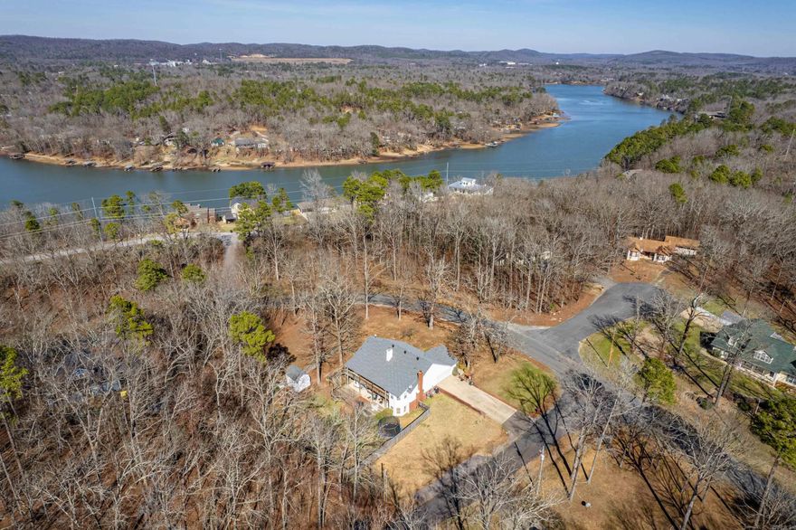 Located in the Heart of the Diamondhead Community is your next forever home.  You are with in walking distance to the clubhouse, pool, or golf course while enjoying plenty of your own space on 2 large corner lots.  Access to Lake Catherine for boating and fishing is a short drive as well.  Enjoy setting on your large back deck sipping coffee and watching the deer feed through your back yard.  The well maintained fenced in yard gives your pets all the room they need to enjoy the day as well.  This beautiful, spacious, and well maintained home sets up perfect for all you need on the main level then you have a wonderful 1200 Sq. ft. finished basement with living space and 1B/1B.  Great for guest or an in-law quarters.   Main level HVAC replaced 2023, New Roof in 2019 Seller also owns 1 of only 10 boatslips on Lake Catherine for Non-Lakefront property owners.  This can be purchased separately if desired. Located only a 1/2 mile from the home.