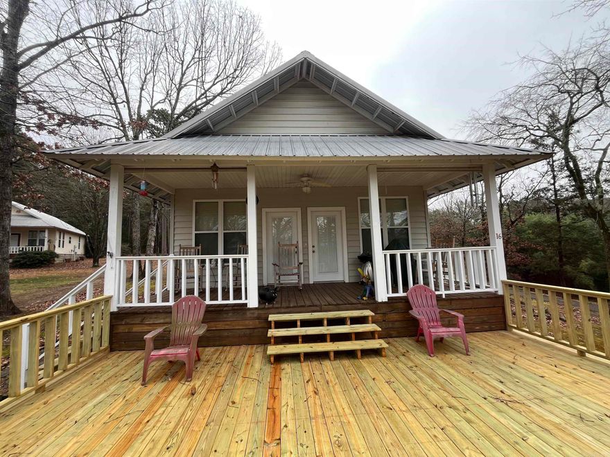 Check out this beautiful home located just across the street from the lake with a beautiful lake view! Sit on the front porch in your rocking chairs with your coffee in hand and relax! There has been a new deck built at the end of 2025 which allows for plenty of space for entertaining. This property comes furnished! Just bring your clothes and move on in! Call us today and let us get you in to see!