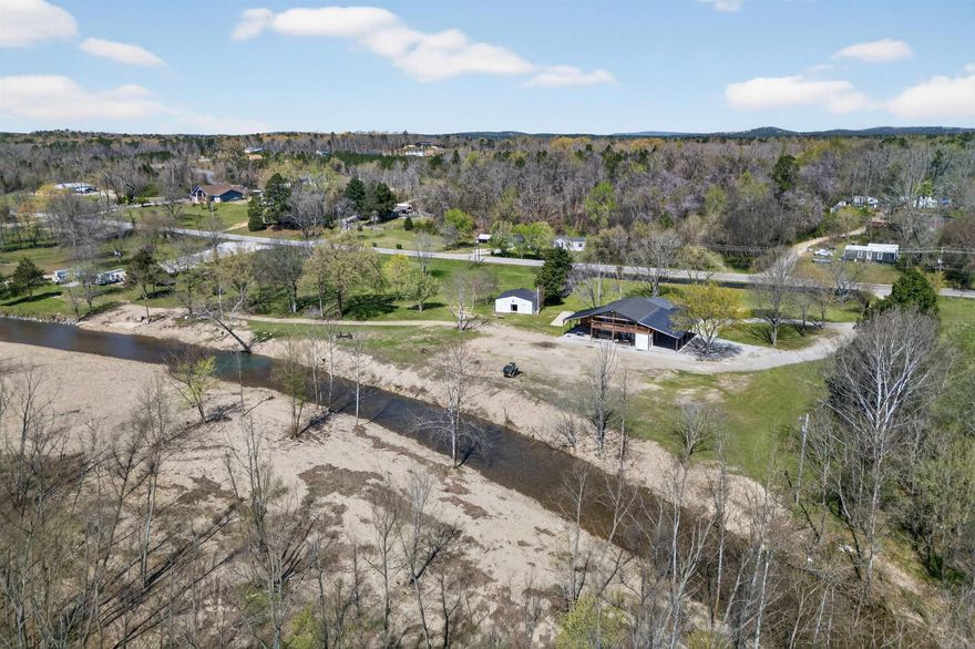 Experience the perfect blend of comfort, functionality, and outdoor beauty at 6766 Park Ave in Hot Springs, AR. Nestled on over 14 acres with extensive river frontage, this property offers space, privacy, and endless possibilities. The exterior provides a peaceful setting with room to roam, entertain, or expand. Inside, the open-concept kitchen features sleek cabinetry, ample counter space, and a layout that flows seamlessly into the living and dining areas—perfect for gatherings. The primary bathroom has been beautifully updated with a spacious walk-in tile shower, modern finishes, and a clean, contemporary design. A standout feature is the massive shop, offering incredible versatility with space for hobbies, storage, entertaining, or a home-based business. Whether you’re looking for a private retreat, investment opportunity, or multi-use property, this one delivers the best of both indoor comfort and outdoor living.