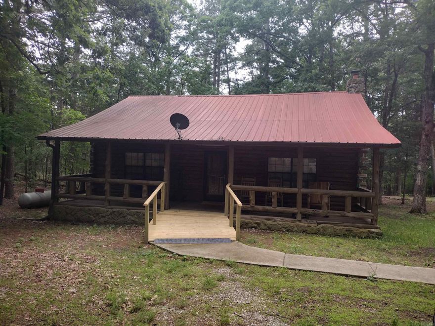 Escape to the woods, and unwind in this cozy ceder log cabin, featuring a expansive front porch. The cabin boasts 2 bedrooms and 2 Bathrooms, and a loft that can be utilized as an additional bedroom. Also includes whole house generator that's 1 year old. Abundant wildlife on this 5.62 acres and conveniently located conveniently located approx. 10 minutes  from Mountain View AR.