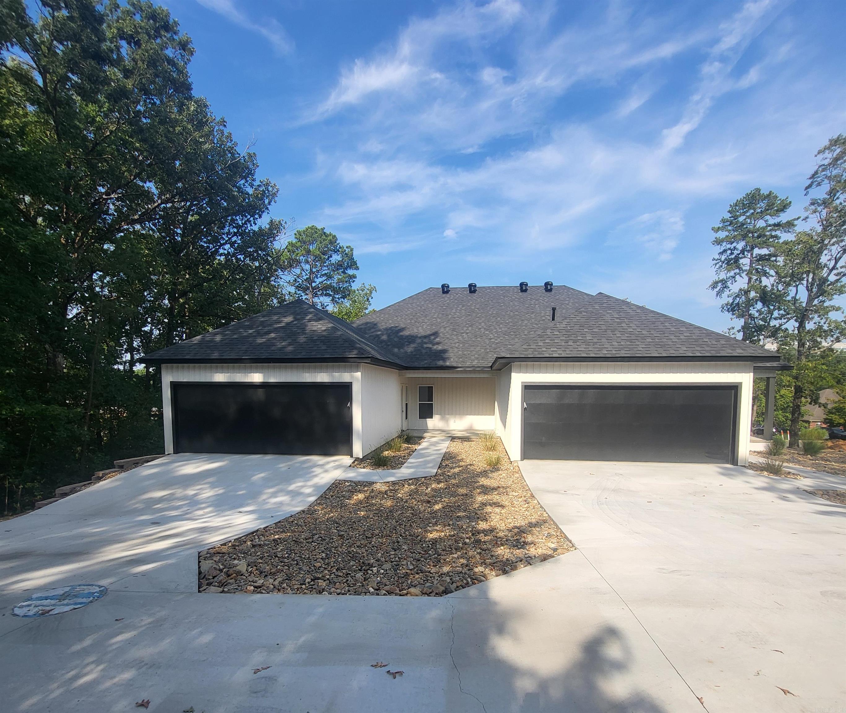 Luxury 2-bedroom 2 bath townhomes with elegant finishes! This new construction was just completed and is conveniently located in West Little Rock off Kanis Road. You have to check out this top-of-the-line home with a 2-car rear-loading garage and covered patio! This home features luxury vinyl flooring throughout and no carpeting. The chef of the family will love the spacious kitchen and lots of custom cabinets. Spacious great room and electric fireplace for year-round enjoyment. There will be no need to look at the rest after you see the best! No Pets allowed.