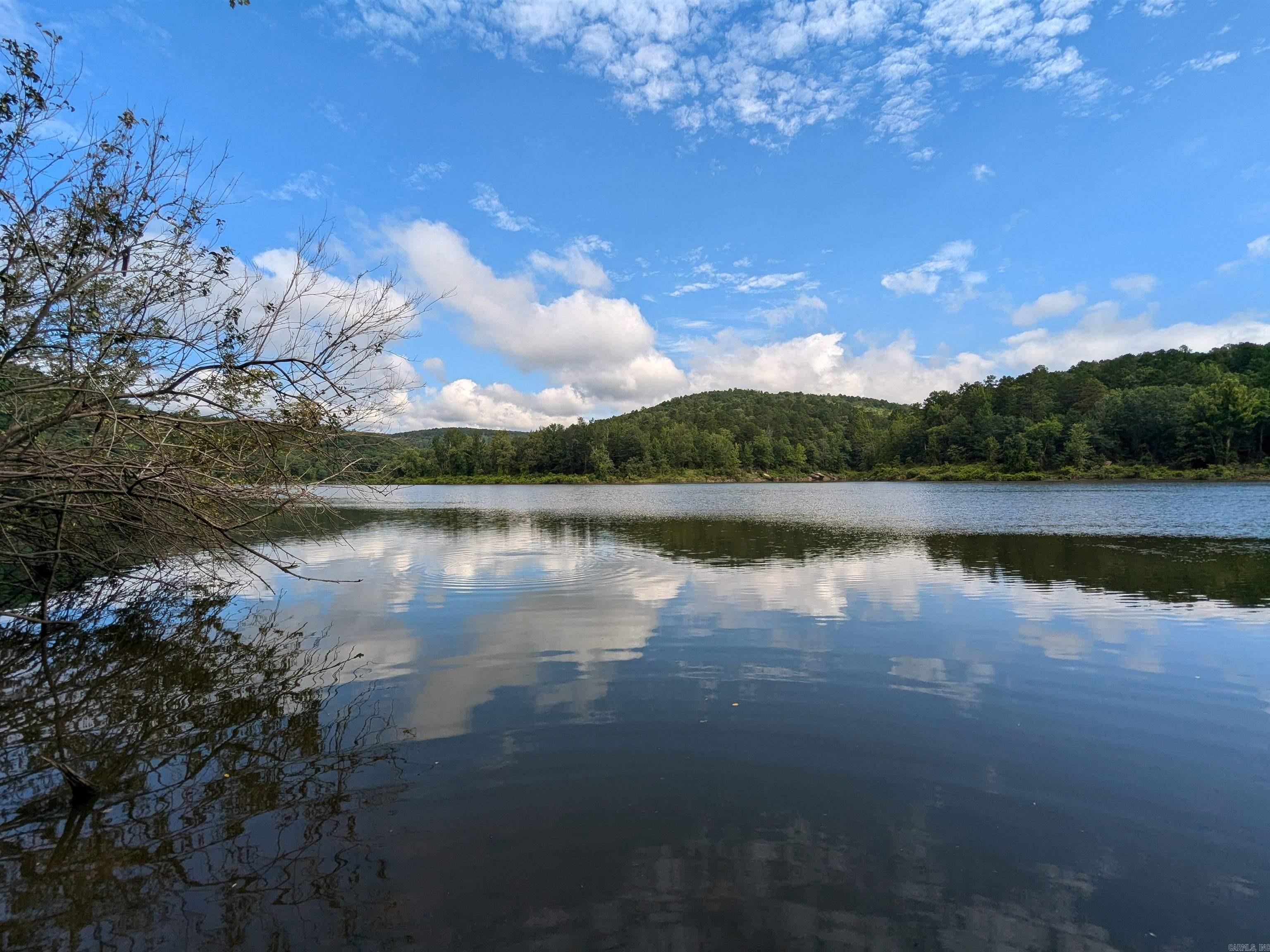 25.82 Acres Bordering Greers Ferry Lake | Over 1,500 Feet of Lakefrontage | No Restrictions Rare opportunity to own 25.82 surveyed acres with approximately 1,508 feet of lake frontage on beautiful Greers Ferry Lake. This private, gated property offers excellent seclusion with mature hardwoods, a lovely forest setting, and a winding trail that stretches the length of the property. Enjoy abundant wildlife including deer, excellent fishing, and seasonal wet-weather streams with small waterfalls. A boat slip is conveniently located less than one mile from the property gate, and electricity is available nearby at the road. No restrictions, giving you the freedom to build, camp, hunt, or develop as you wish. Whether you're looking to create a private retreat, hunting getaway, or future lakefront home, this unique property combines privacy, natural beauty, and direct access to one of the most desirable lakes in Arkansas. GPS Coordinates: 35.63555, -92.21164
