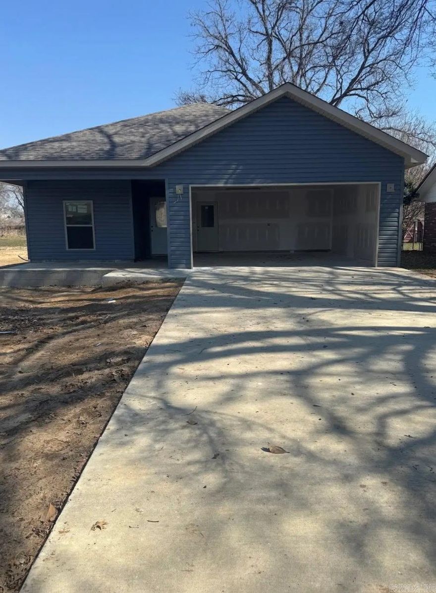 Welcome home to your custom-build home in Mississippi County. 3 bedrooms, 2 bathrooms, spacious, attached garage, with new and modern finishes. New range oven, microwave, and dishwasher.