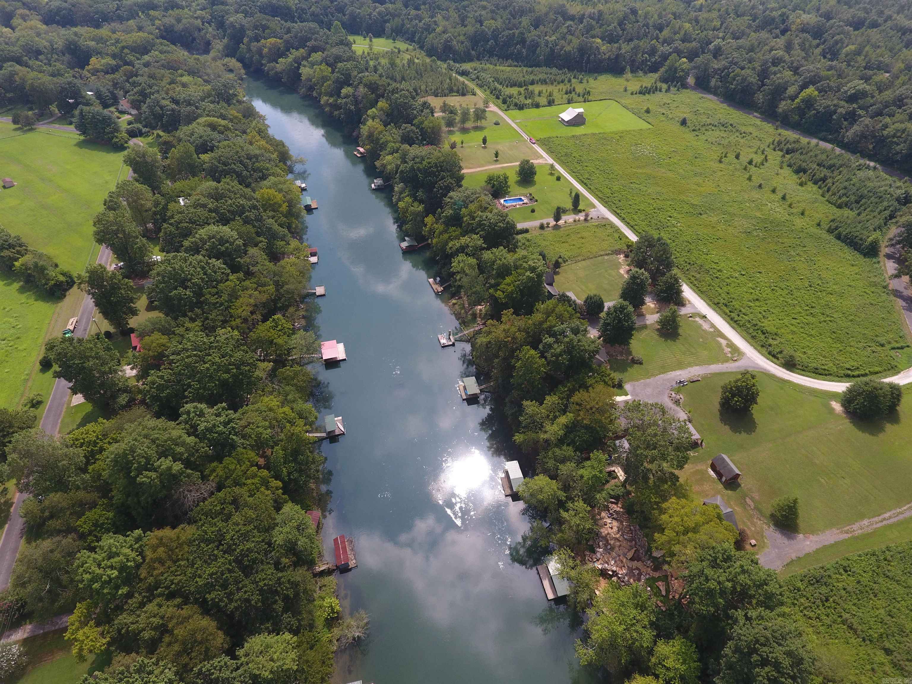 Inner lot in quiet platted subdivision within walking distance of Dripping Springs boat landing and Little Red River access. Flat 1ac+/- lot ready for clearing and building, with underground electric service, gas, water and survey on file.