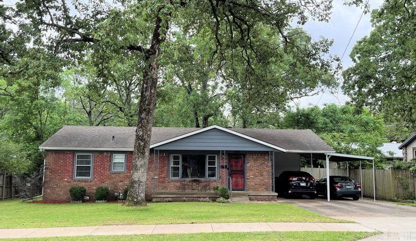 Cute, Cute, Cute! Move-In Ready with lovely true hardwoods throughout (no carpet) * Kitchen features updated cabinetry, slab granite counter-tops, gas range, spacious dining space and farmhouse sink overlooking the kids playing kickball & soccer in the rear yard * Updated lighting/doors/hardware/200 AMP service * Totally remodeled Bathrooms from top to bottom * Tremendous Oak trees shade you from summer heat - ideal for grilling out with all your friends & family * Across the street from The Greens at North Hills ... enjoy the pond/fountain/fairway seasonal views * Large Laundry room & tank-less water heater * Carport with large extra pad for 2+ car parking and room for guest parking - double gates allow access to the rear yard * See Agent remarks for comp data