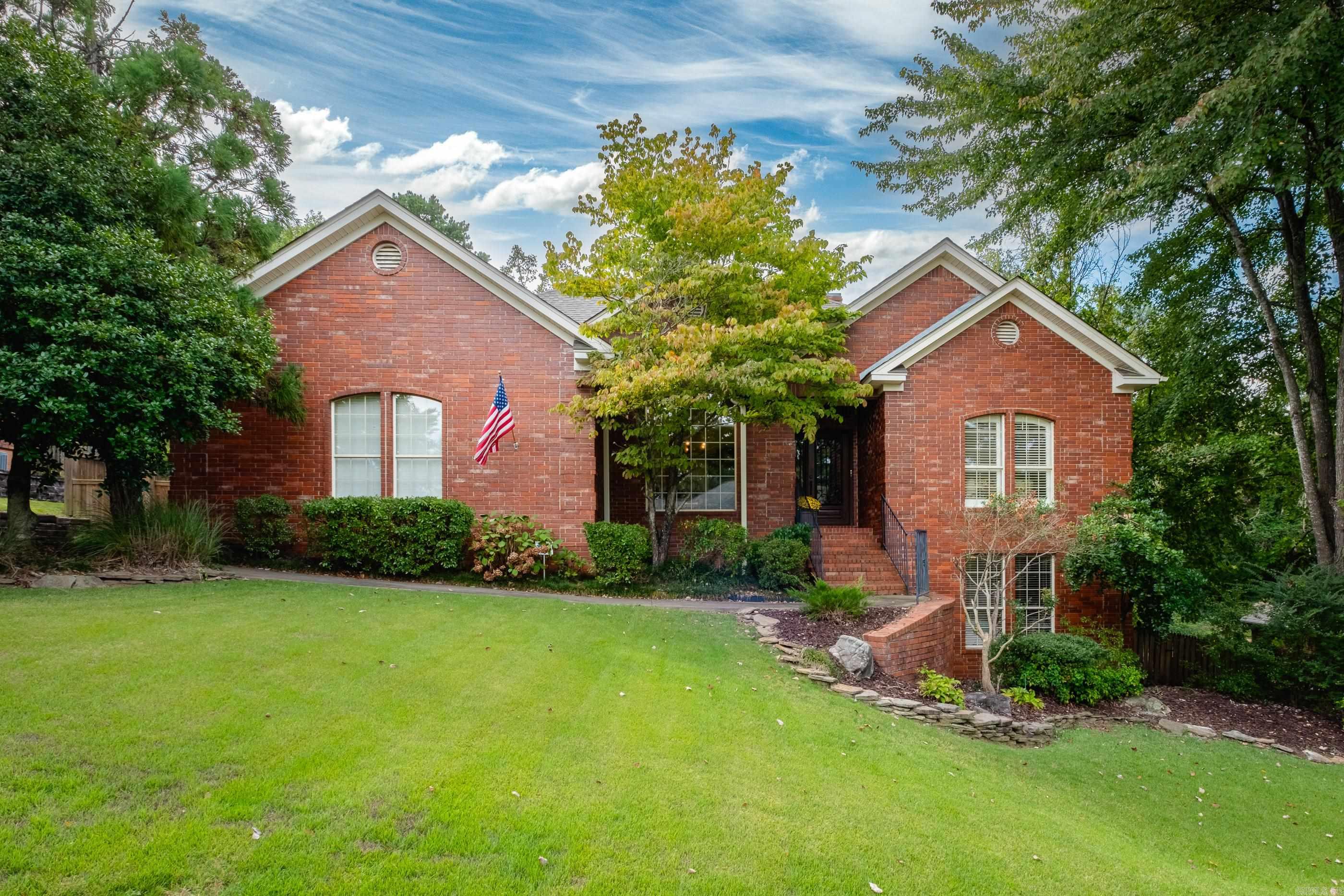 Delightful home located in the desirable Ranch Subdivision. The master suite, set apart, features his & her walk-in closets, a spacious bathroom w/ a whirlpool tub beneath a skylight, & a large walk-in shower. An extra upstairs room provides flexibility, ideal as a formal sitting room, office, or bedroom. Downstairs, you’ll find two generously sized bedrooms, both w/walk-in closets & a shared bath that provides plenty of room for everyone. Storage galore, with ample closet space and a large laundry room offering a large functional work space. Step outside to a peaceful screened-in porch, ideal for enjoying quiet mornings or relaxing afternoons, surrounded by lush green space that offers a private, serene atmosphere. The side yard is perfect for children’s activities, from kickball games to yard fun. A side-load garage adds convenience, while pond access opens up outdoor possibilities, including exploring the Little Maumelle River, a private play area & access to the Nature Conservatory, home to scenic trails and excellent hiking opportunities.This home offers it all—great location, abundant space, and serene living.  Schools, dining, banks & shopping just steps away!  See today!