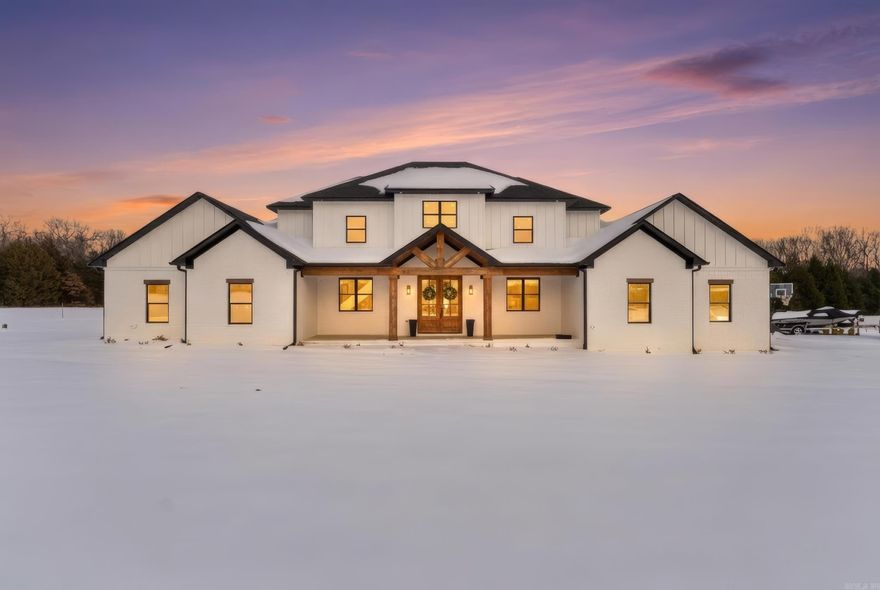 Welcome to your dream estate — a stunning luxury residence perfectly blending elegance, comfort, and outdoor beauty on a private 3.12-acre sanctuary.  Step inside to discover grand high ceilings and expansive living spaces that radiate sophistication and openness. Every bedroom boasts spacious walk-in closets, providing abundant storage and organization. The heart of the home features a gourmet kitchen with premium finishes, TWO dishwashers and a double oven complemented by expansive natural light and seamless flow to living and entertaining areas. Relax and entertain year-round with a beautiful outdoor living area, complete with a custom outdoor fireplace, perfect for cool evenings and social gatherings. The property also includes a stocked pond, providing a perfect backdrop for outdoor enjoyment. Practical luxury continues with electrical infrastructure ready for an EV charging station and a future hot tub on the back porch adjacent to the primary suite, offering easy connectivity and convenience for today’s modern lifestyle. Set against breathtaking scenery and wide open space this property also welcomes chickens, allowing for a touch of country living and self-sufficiency.