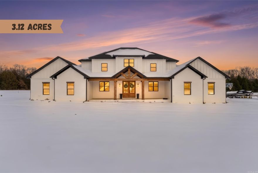 Safe Room, Hot Water Recirculation for Fast Hot Water, two dishwashers, EV charging infrastructure available for cars, insulated garage, chickens welcome, pump for extended warm water in jacuzzi tub & high speed fiber optic internet available!  Welcome to your dream estate — a stunning luxury residence perfectly blending elegance, comfort, and outdoor beauty on a private 3.12-acre sanctuary.  Step inside to discover grand high ceilings and expansive living spaces that radiate sophistication and openness. Every bedroom boasts spacious walk-in closets, providing abundant storage and organization. The heart of the home features a gourmet kitchen with premium finishes, TWO dishwashers and a double oven complemented by expansive natural light and seamless flow to living and entertaining areas. Relax and entertain year-round with a beautiful outdoor living area, complete with a custom outdoor fireplace, perfect for cool evenings and social gatherings. The property also includes a stocked pond, providing a perfect backdrop for outdoor enjoyment. Practical luxury continues with an outlet for a future hot tub on the back porch adjacent to the primary suite.