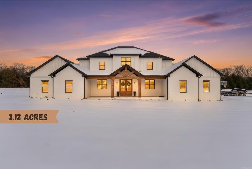 Safe Room, Hot Water Recirculation for Fast Hot Water, two dishwashers, EV charging infrastructure available for cars, insulated garage, chickens welcome, pump for extended warm water in jacuzzi tub & high speed fiber optic internet available!  Welcome to your dream estate — a stunning luxury residence perfectly blending elegance, comfort, and outdoor beauty on a private 3.12-acre sanctuary.  Step inside to discover grand high ceilings and expansive living spaces that radiate sophistication and openness. Every bedroom boasts spacious walk-in closets, providing abundant storage and organization. The heart of the home features a gourmet kitchen with premium finishes, TWO dishwashers and a double oven complemented by expansive natural light and seamless flow to living and entertaining areas. Relax and entertain year-round with a beautiful outdoor living area, complete with a custom outdoor fireplace, perfect for cool evenings and social gatherings. The property also includes a stocked pond, providing a perfect backdrop for outdoor enjoyment. Practical luxury continues with an outlet for a future hot tub on the back porch adjacent to the primary suite.