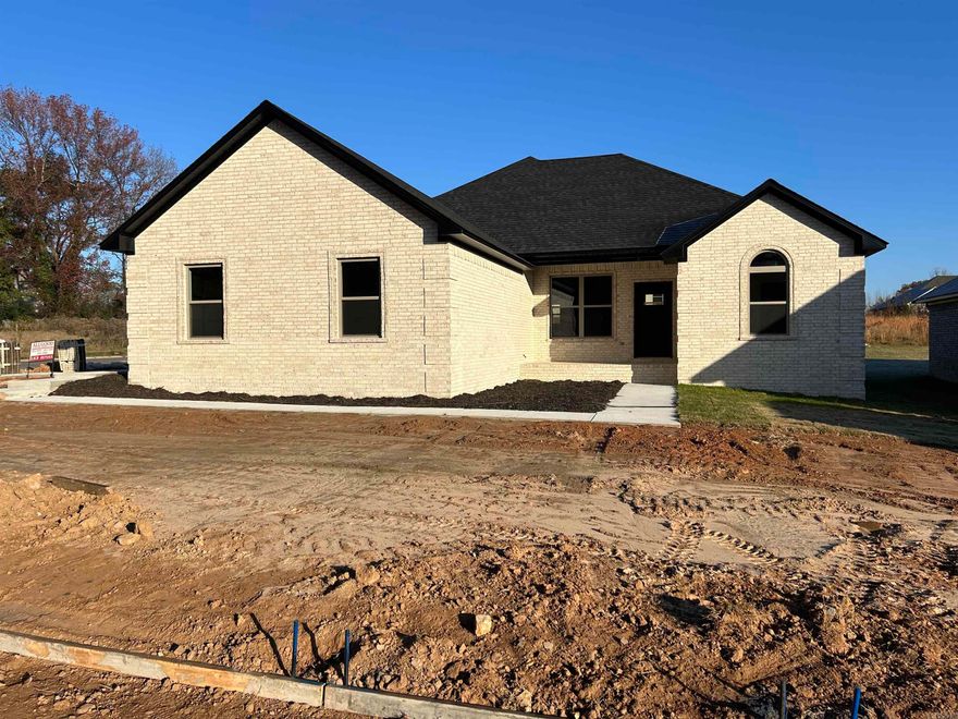 Super nice all brick house on corner lot with side loading garage .Open airy floor plan with dining area and big bar pantry beautiful granite countertops and custom wall fireplace with heat with custom flame design .Beautiful split bedroom design with private m/br and bath area large soaking tub 2 walk-in closets separate vanity for his and hers .STAINLESS steel appliances and beautiful backsplash and light fixtures.This house is move in ready lacks a few final touches but move in by Christmas .