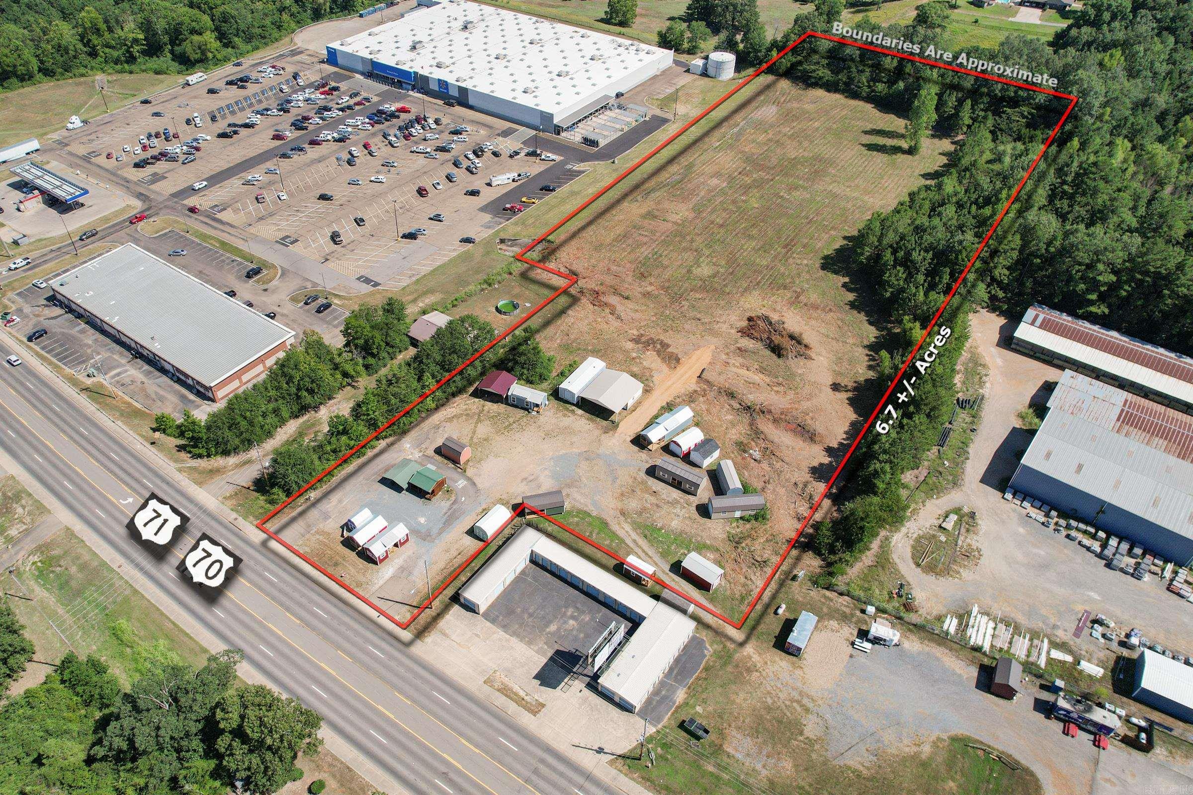 Get a look at this location! With over 300ft of highway frontage and 6.720 acres in between Walmart and Baileys Discount Buildings Supplies, the possibilities are endless for this property. City water and city sewer included.