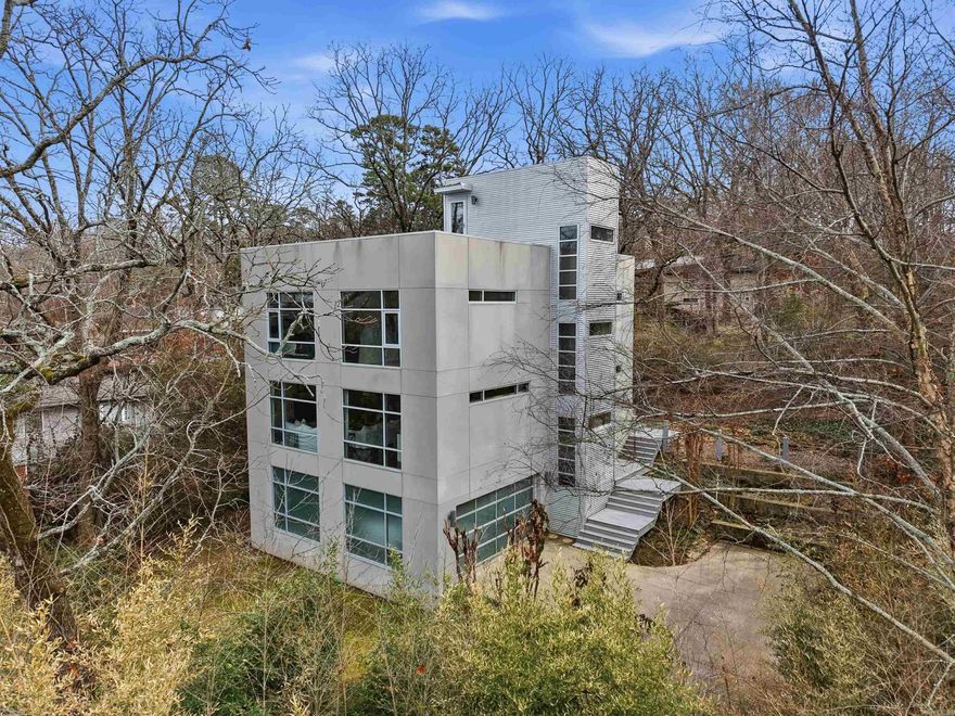 Modern Masterpiece in Historic Hillcrest. Discover a stunning blend of contemporary design & classic location. Open, light-filled floor plan with expansive windows and tree-top views. Meticulously maintained, this one-of-a-kind residence has the flexibility of having two primary suites or guest quarters. This home offers elegant open-concept living & dining areas with an abundance of natural light. The modern chef’s kitchen is perfect for entertaining. There are beautifully finished hardwood floors throughout. Adjacent to the bedrooms is a dedicated office/library space with custom built-ins. Don't miss the heated & cooled workout room off the 2-car garage! Easy access to neighborhood amenities, dining & downtown.