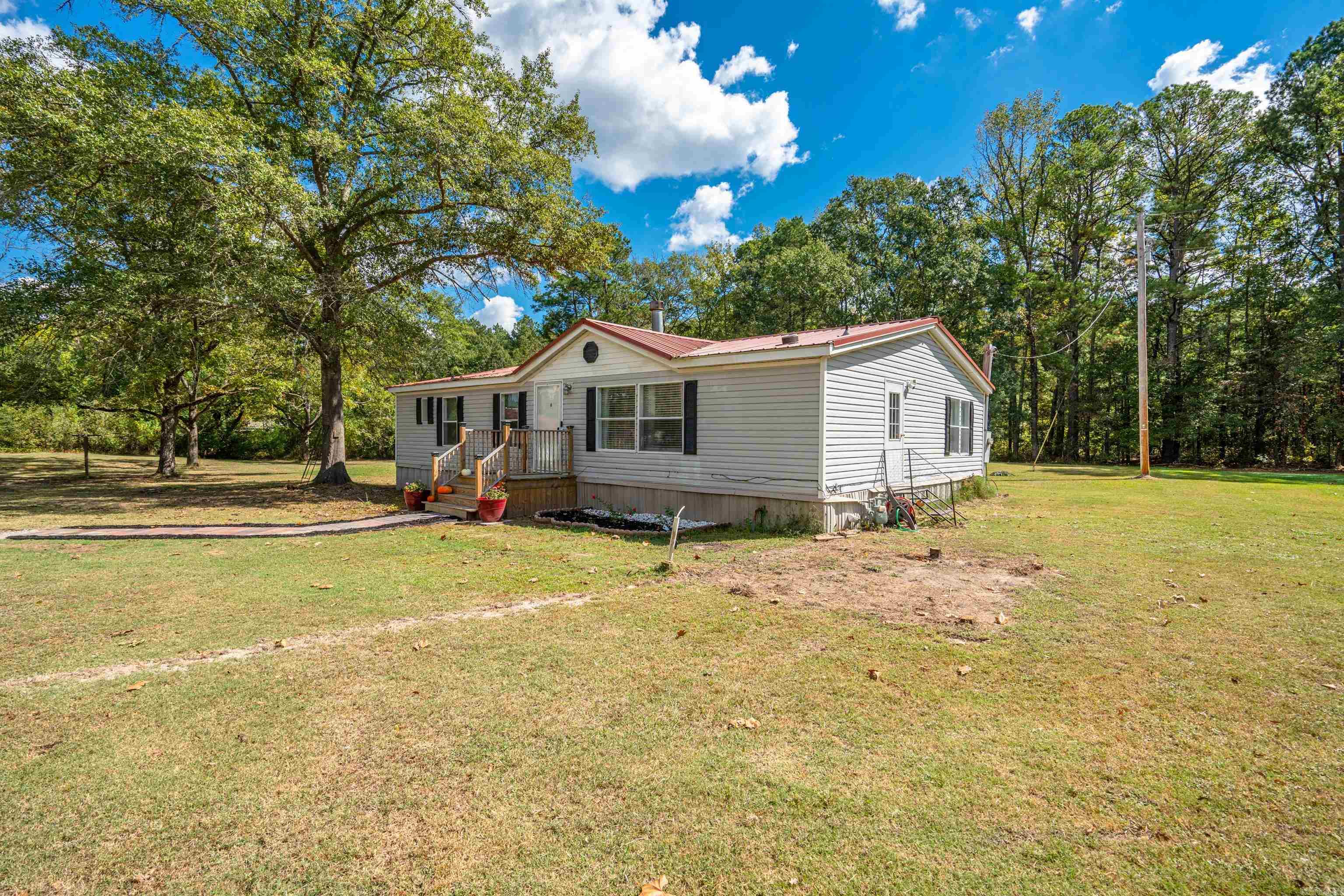 This home has been updated, loved and brought back to life since being purchased! New hot water heater, all new appliances, new lighting, new gas logs and so much more!! The home offers over 1.9 acres for room to spread out! It even has pecan trees! There are two other structures on the property and both have concrete floors and one even has electric! It could easily become the perfect place for what you desire whether it's a she shed, gym, music studio, gaming or any other passion you have. Make an appointment today to see this peaceful homeplace.