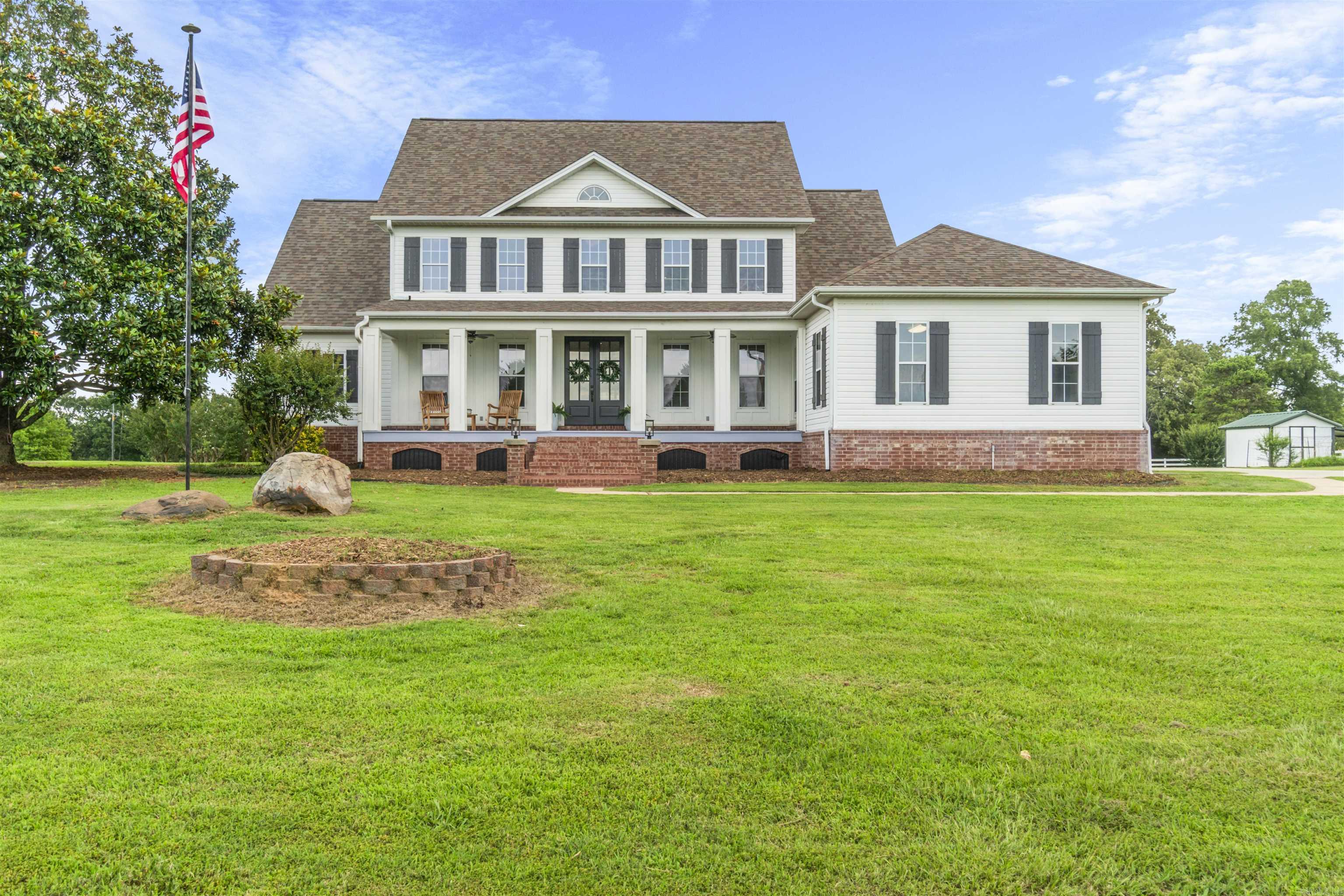 Nestled on 10.22 beautiful acres in a gated community, this stunning 5 bed, 3.5 bath home perfectly blends luxury and country charm! Fully renovated in 2021, it features a grand entry with custom double doors, formal dining, and private study. The cozy den boasts soaring ceilings and floor-to-ceiling windows. A dream kitchen with quartz countertops, stainless appliances, and island opens to a darling breakfast nook and a 640 sq ft covered deck-ideal for enjoying gorgeous sunrises and sunsets. The primary suite is downstairs with a spa-like bath, soaking tub, walk-in shower, and double vanities. Upstairs offers 4 bedrooms and ample space for family or guests. Enjoy peaceful views and endless possibilities with a 50x50 barn-perfect for an equestrian setup. Underground utilities, natural gas, and fiber internet add convenience. This property is a rare gem! Schedule your private tour today.