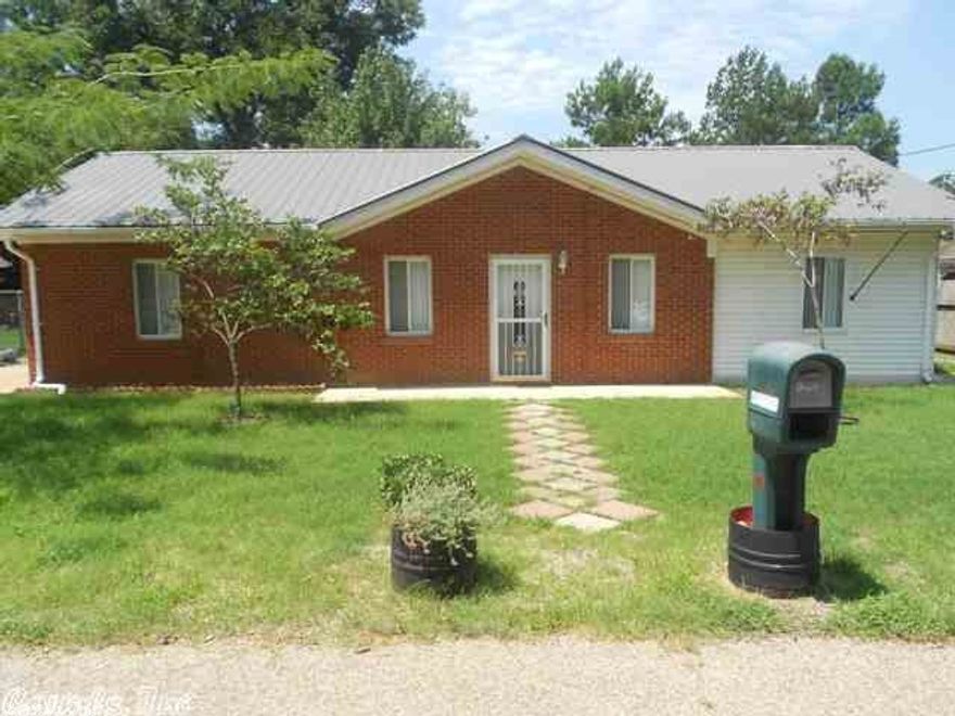 This newly renovated 3 bedroom/2 bath home features brick, vinyl siding, and a metal roof.  A "mother-in-law: plan allows for privacy and space featuring a family room, dining room and storm shelter.  The kitchen is charming with abundant cabinet and counter space and built-in microwave.  Other amenities include a laundry closet, large workshop/garage.  Storm shelter large enough for 8.  Flooring, cabinetry and window are all new.  This is a great deal.