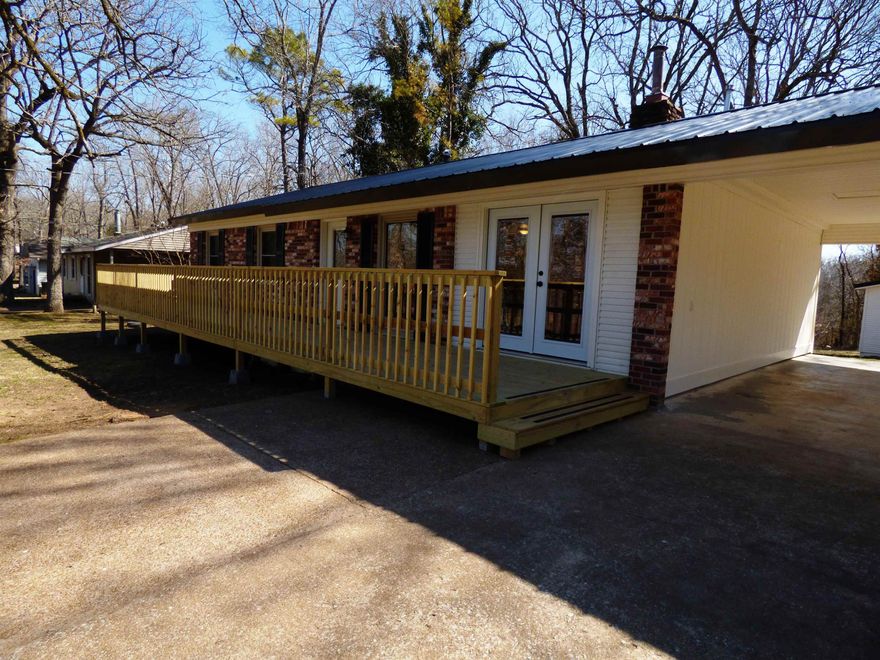 3 BR 1.5 BA, metal roof; 40 ft wide deck; central HVAC; vinyl plank flooring, carpet;   refrigerator, stove and dishwasher. Custom barnwood bar & island. Flat large back yard & front yard. Includes a man cave or She shed. Rent, Security Deposit and last months rent required.  Must pass a credit and reference check.