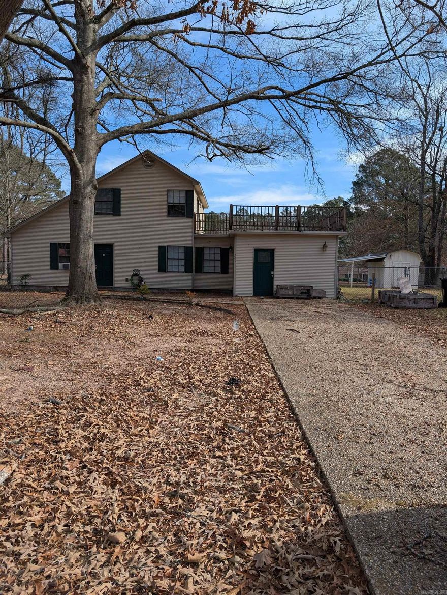 Beautifully Updated Home on Nearly 1 Acre in Hampton, AR! Welcome to 265 Watson Street - a beautifully upgraded 3-BR, 2-BA home offering 1,789 sqft of comfortable living space on a generous 0.90-acre lot. This move-in-ready property blends modern updates with functional design, making it perfect for families or anyone seeking space and privacy. Inside you’ll find durable tile and laminate flooring throughout, creating a clean, low-maintenance environment. The thoughtful layout includes one bedroom and one bathroom upstairs, plus two bedrooms and one bathroom downstairs, offering flexibility for guests, work-from-home, or multi-generational living. The upstairs landing is filled with natural light from a charming skylight, adding warmth and character to the space. The home includes a washer and dryer, major appliances, and a 40-gallon gas water heater for efficiency and comfort. Outside, enjoy a fully fenced backyard — perfect for kids, pets, or entertaining — along with an 8x10 storage building for tools, hobbies, or extra storage. Located in Hampton, Arkansas and built in 1980, this home has been totally upgraded and is ready for its next owner. Don’t miss your chance! *1 BR up.