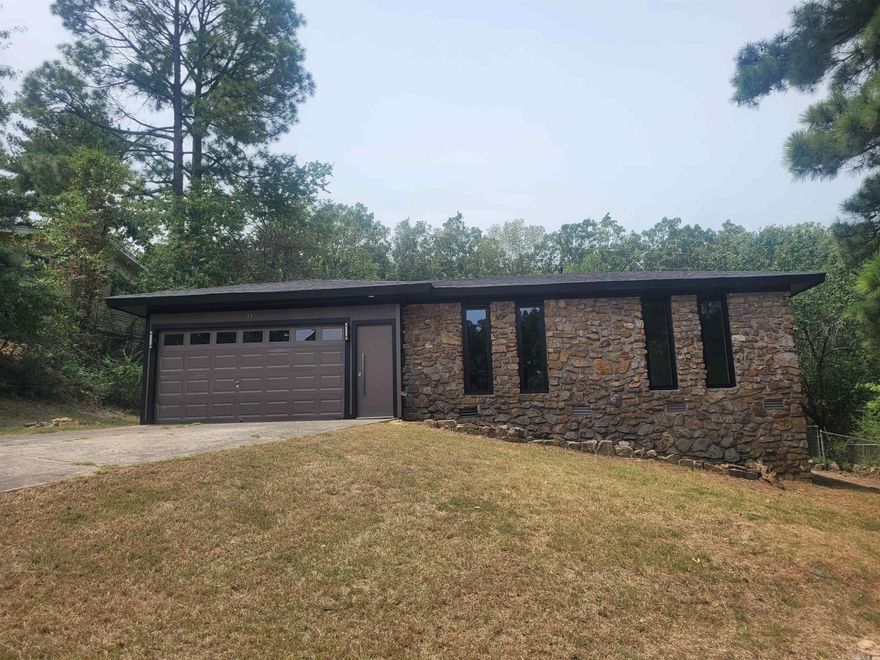 A Must-See Starter Home in a well-established neighborhood.  This is an updated rock home with a modern twist. Home has an open concept. Updates throughout the home include a new roof, new windows, newly renovated bathrooms, fresh paint (inside & out). This home comes with new flooring throughout, new stainless-steel appliances, a new sink and countertop, updated fixtures and new lighting. A huge, fenced backyard for entertainment.  It has a separate laundry area and a two-car garage, additional storage in the garage area. Conveniently located near shopping and dining, only minutes from the interstate. This one is ready for you to move on in. Call today to schedule a showing! Agents, please see confidential remarks.