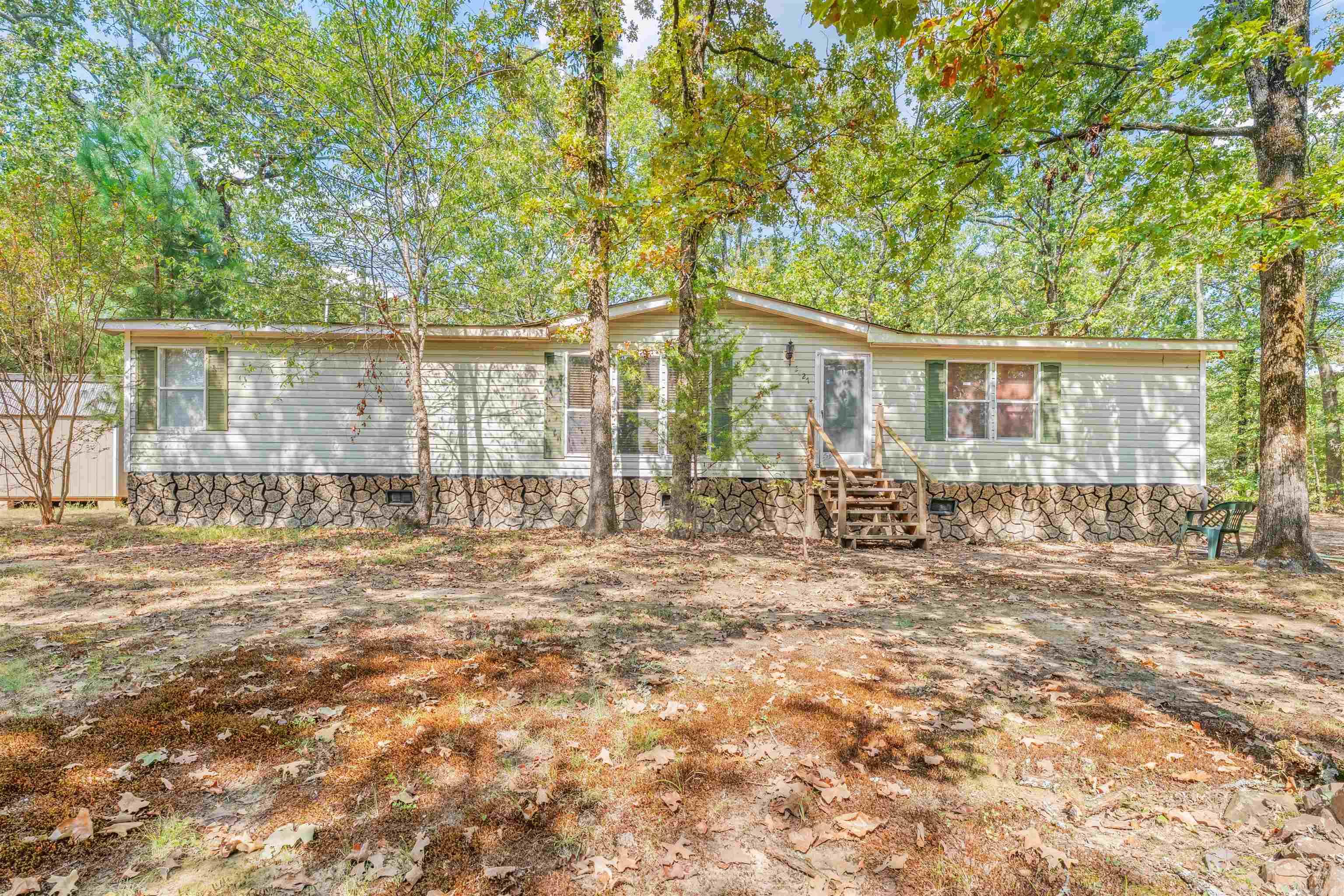 If you are looking for some land and a shop... this is it! The home is a double wide on a permanent foundation with a split floor plan and a large kitchen. There is also a large shop 28' x 42' with a garage door and concrete floor. This is a handyman's dream shop. There is also an storage building 12' x 24' that's very nice too. There is an above ground pool. It needs a new liner but the bones are still good and the pump works. Call today to see this in person.