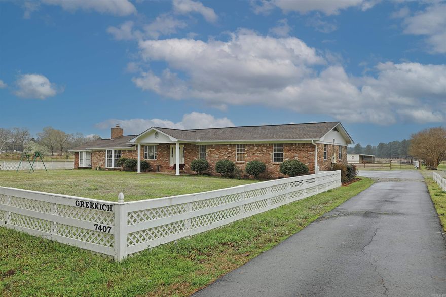 Welcome to this exceptional 38-acre property offering country living and modern comfort! This versatile property features pastureland, a scenic pond, and well-equipped holding pens for cattle and horses. The property includes a tack room w/electricity and water, making livestock care convenient and efficient. A spacious SHOP adds incredible functionality with its own kitchen area, complete with sink and stove, perfect for projects, entertaining, or additional workspace. You'll also appreciate the covered carport with extra outdoor storage and a charming breezeway connecting spaces. Inside the home, you’ll find 4 bedrooms and 2 bathrooms, highlighted by beautiful wood floors and a stunning wood ceiling in the oversized bedroom that adds warmth and character. The primary suite features a fully updated bathroom with a tile shower, while the guest bathroom has also been tastefully updated with tile finishes. Property includes a large laundry room with washer and dryer included. The roof was replaced in 2021, providing peace of mind for years to come. Whether you're looking for a working farm, a peaceful retreat, or room to roam, this property delivers endless possibilities! Call today!