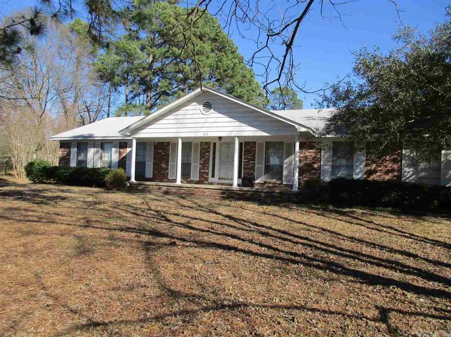 This is a home in residential neighborhood that sits on 1/2 acre.  The property is zoned for C-2, so its great for home or business.  Solid surface counter tops, 2 fireplaces, no carpet and fenced in backyard.