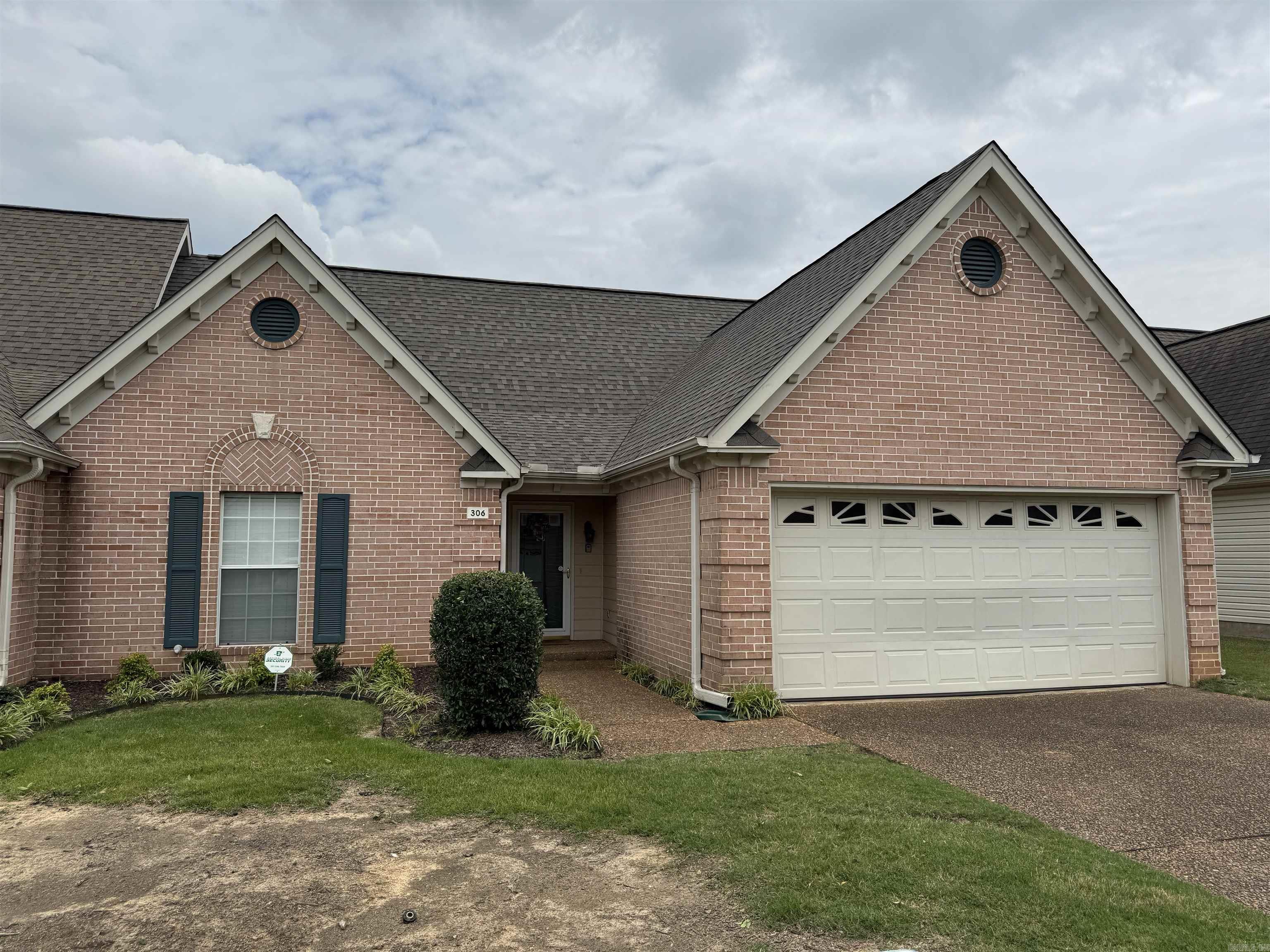Welcome to 306 Country Squire Lane. This 3/2 condominium boasts a tranquil setting on a quiet street, offering effortless access to Searcy's array of amenities. The inviting Living room features a cozy fireplace and an attached garage for added convenience, making this property an ideal blend of comfort, style and a prime, desirable location. New roof May 2025, HVAC Nov. 2023 and Hot-water 2019. Freshly painted and updated. Call today to see this beautiful condo that you are going to want to call home. Agents see remarks.