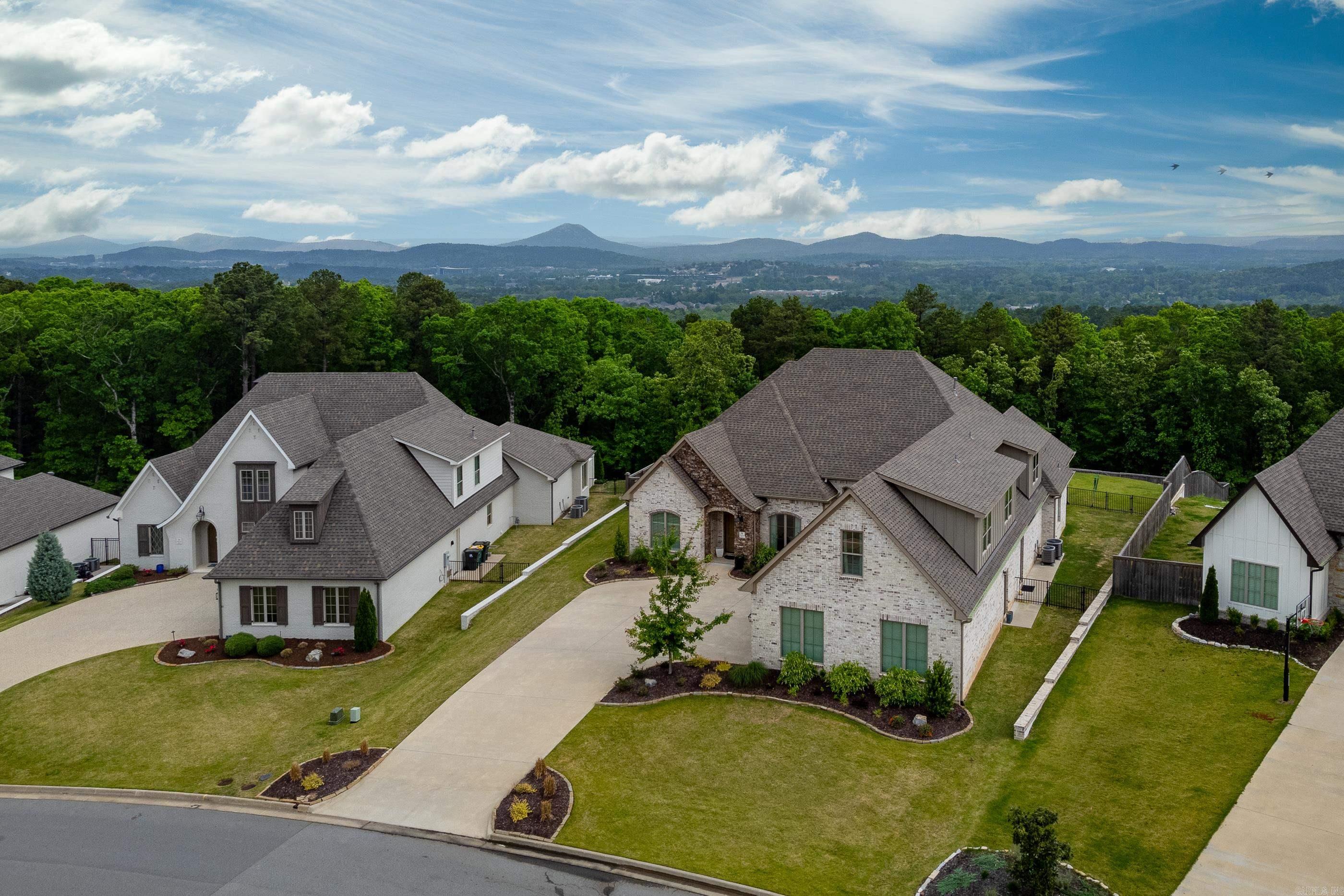 Stunning retreat in Falstone features a welcoming layout & outdoor pool paradise! Custom Jackie Stevens home built in 2021 offers top-of-the-line elegance & comfort. Hardwood floors, soft-close drawers/cabinet doors, 10ā ceilings & custom 8ā doors. 5 beds/4 full/2 half baths. Main level has 3 bdrms including primary suite, full bath, office, half bath, laundry, dining & living rm provide a view of the yard/pool. Primary suite w/ views/access to the patio/pool, walk-in shower, heated floors, double sinks, soaker tub & closet w/ built-in dresser. Gourmet kitchen showcases quartzite counters, GE Monogram gas range w/ remote-powered hood, Bluetooth double ovens, microwave, ice maker, pantry, built-in Frigidaire freezer/fridge & breakfast area. Upstairs are 2 bdrms w/ ensuite baths, half bath & bonus room w/ wet bar & beverage fridge. Walk-out covered outdoor living area, woodburning FP, built-in Bull gas grill w/ stone/quartzite counter surround, heated gunite pool/spa that overlooks large yard & expansive greenbelt for total privacy. Pool systm w/ iAquaLink controls for cleaning, temps, lights & heater. Central vac. 1,067sqft 3-car garage. Ring camera systm in front/back. See video!