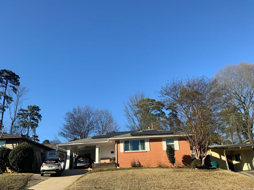 Welcome Home: This 3br, 2 ba Mid Town home offers 1627 square feet and a flexible layout with a second living area.  Many updates to include new windows 2021, living room floors redone 2021, dishwasher, light fixtures, security system, cameras, heating unit 2024, paint throughout the interior, Good Leap solar panels seller will pay off with an acceptable offer.  Large laundry room with storage.  Conveniently located to schools, shopping and hospitals.  There is an alarm system and seller will turn off prior to showings.  There is a cat (Stella) Please do not let her out.