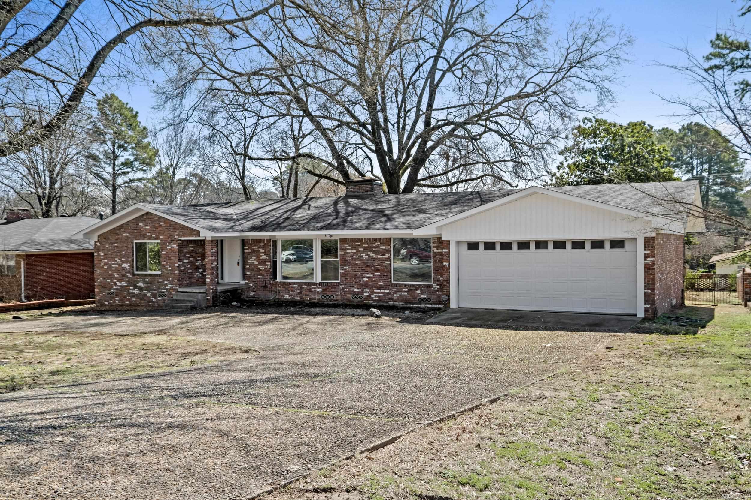 Exceptional 5-bedroom, 3.5-bathroom home located in the heart of Little Rock. Situated on a half-acre lot, this stately home has undergone a complete transformation, offering a perfect blend of classic charm & modern elegance. You'll be impressed by the refinished hardwood floors, paired with new windows that fill the space w/ natural light. The expansive family room greets you w/ its picture windows, elegant fireplace, & custom-built shelves. The updated kitchen boasts exquisite granite countertops, all-new appliances & a convenient breakfast bar. Right off the kitchen, you’ll find a cozy hearth room perfect for relaxing by the fire. A pantry, storage room, half bath & laundry room add to the convenience of this well-designed floor plan. The primary bed is a true retreat, w/ gorgeous hardwoods & 3 closets. Primary bath features double vanity & stunning tiled walk-in shower. Main level you’ll find 3 more spacious bedrooms & a beautifully updated bathroom. Lower level offers incredible flexibility—ideal as an in-law suite or teen quarters with a bedroom, bath, bonus room & extra storage. Step outside & enjoy the tranquility of your all-brick patio. Home has so much more!