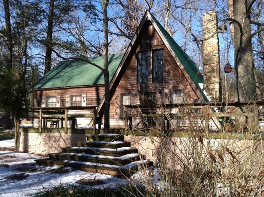 Country charm and the love of nature go hand in hand with this A-frame home with added great room nestled above a creek that flows in the front.  Plenty of outside deck area for entertaining or watching birds, deer and all the other wildlife.  Call today, priced to sell quickly!