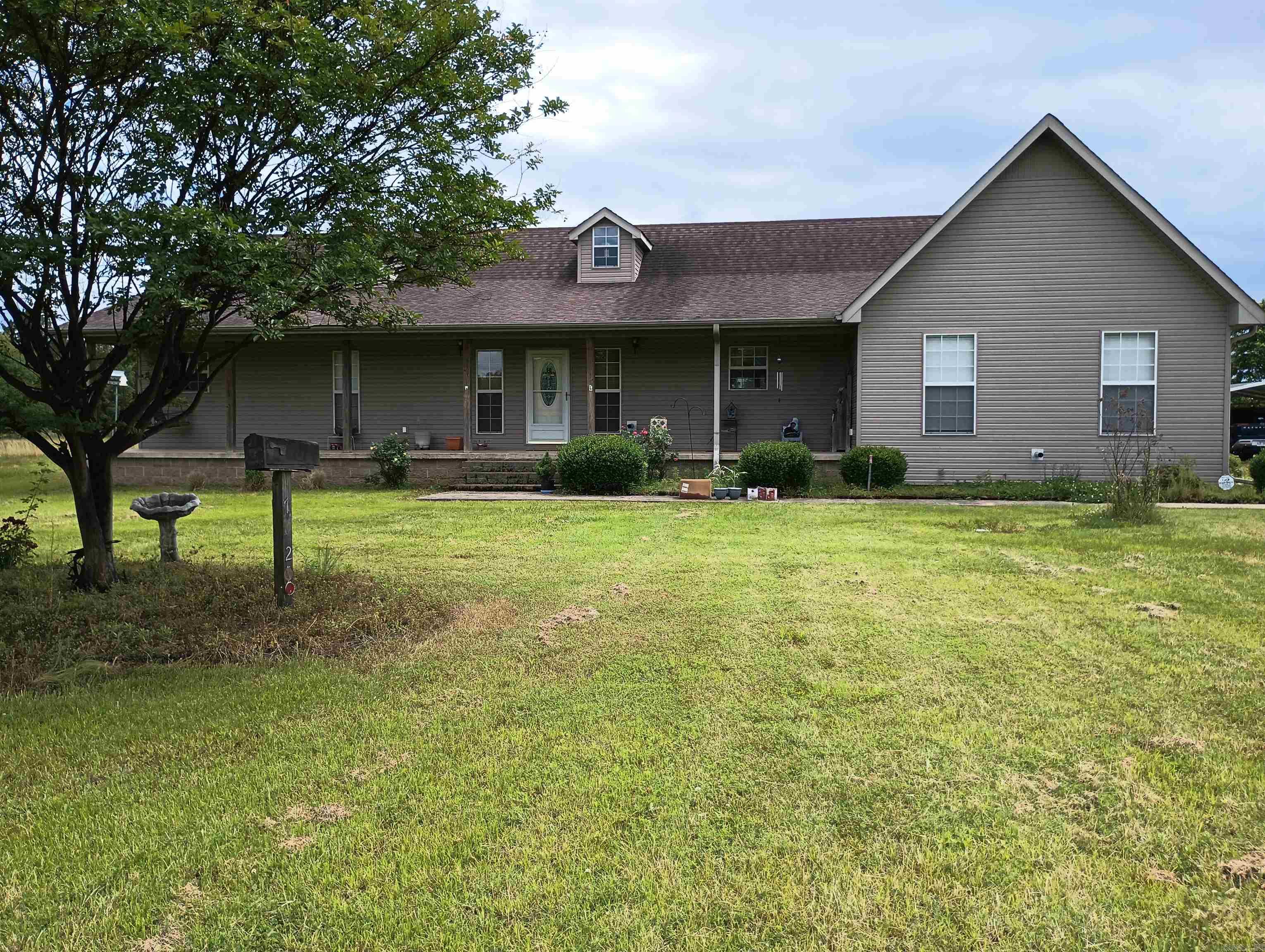 Country Living at it's finest. NEW ROOF IN NOVEMBER! Spacious 2176 sq.ft. all electric home boasts large family room, formal living room, large kitchen/dining, 3 bedrooms, 2 baths, extra large laundry, hardwood flooring, carpet. Large covered deck. Located on 15.20 acres (m/l), mostly pasture, pond, 2 double carports, 10x18 shed w/double carport, 32x36 double garage/game room w/ 1/2 bath and 18x30 carport for camper. 3 septice systems, one for the house, one for the garage/game room and one previously used for a mobile home. Storm shelter in need of repair. Empower Fiber Optic connected. No Flood Insurance required. SEE AGENTS REMARKS.
