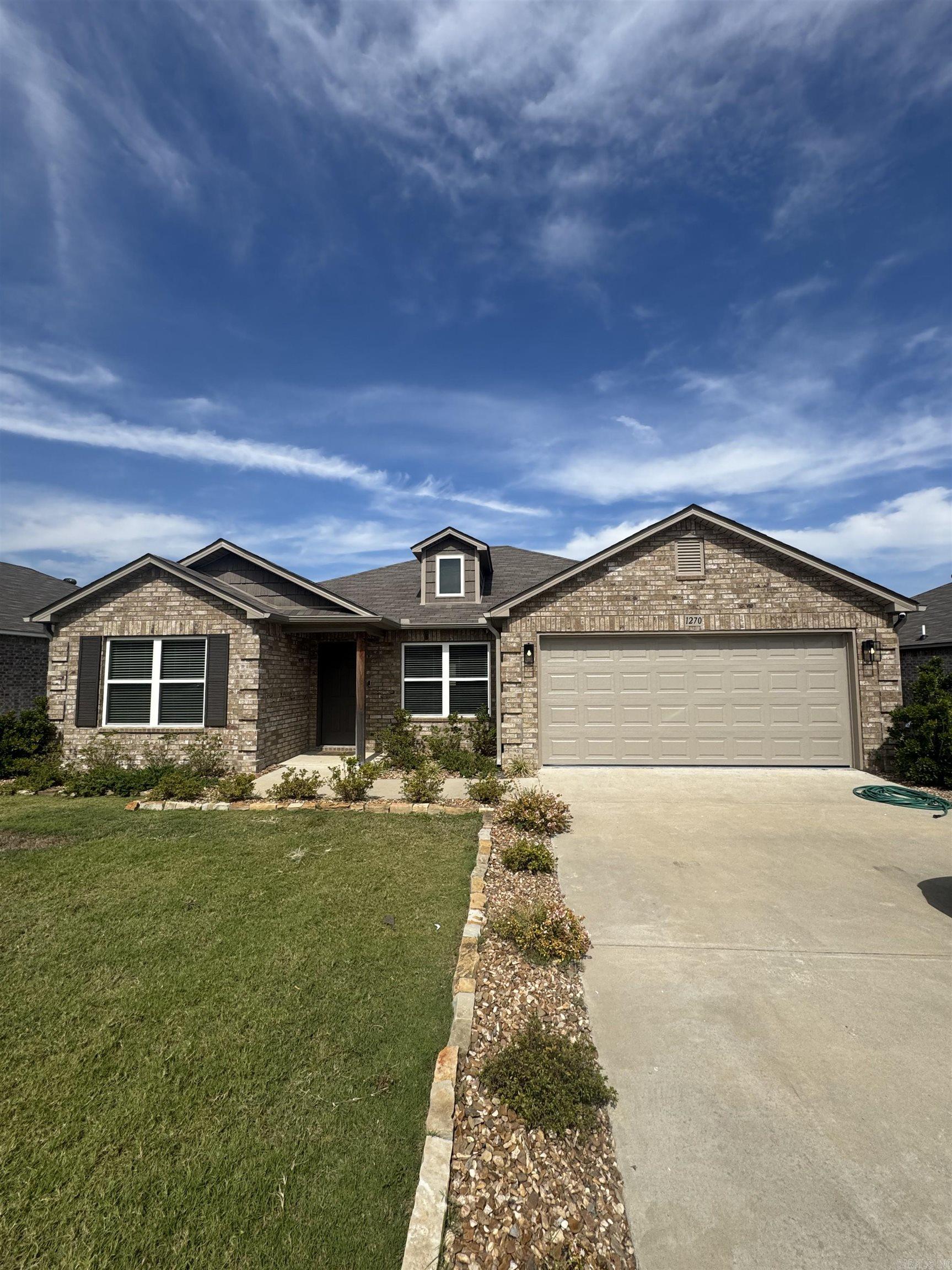 Discover the captivating Carnegie II plan, distinguished by its inviting covered entryway and beautifully landscaped front yard that exudes curb appeal. This thoughtfully designed home encompasses 4 bedrooms and 2 bathrooms, providing ample space for comfort and privacy. The spacious living room offers a welcoming environment for relaxation and gatherings. The kitchen is a chef's delight, equipped with energy-efficient appliances, abundant counterspace, and a convenient pantry for storage. The adjacent laundry room, situated just off the garage, ensures practicality for families of any size. The master suite includes a luxurious walk-in closet, enhancing the home's appeal and functionality. Explore more about this remarkable home today! **SEE SHOWING REMARKS & AGENT REMARKS FOR IMPORTANT INFORMATION**