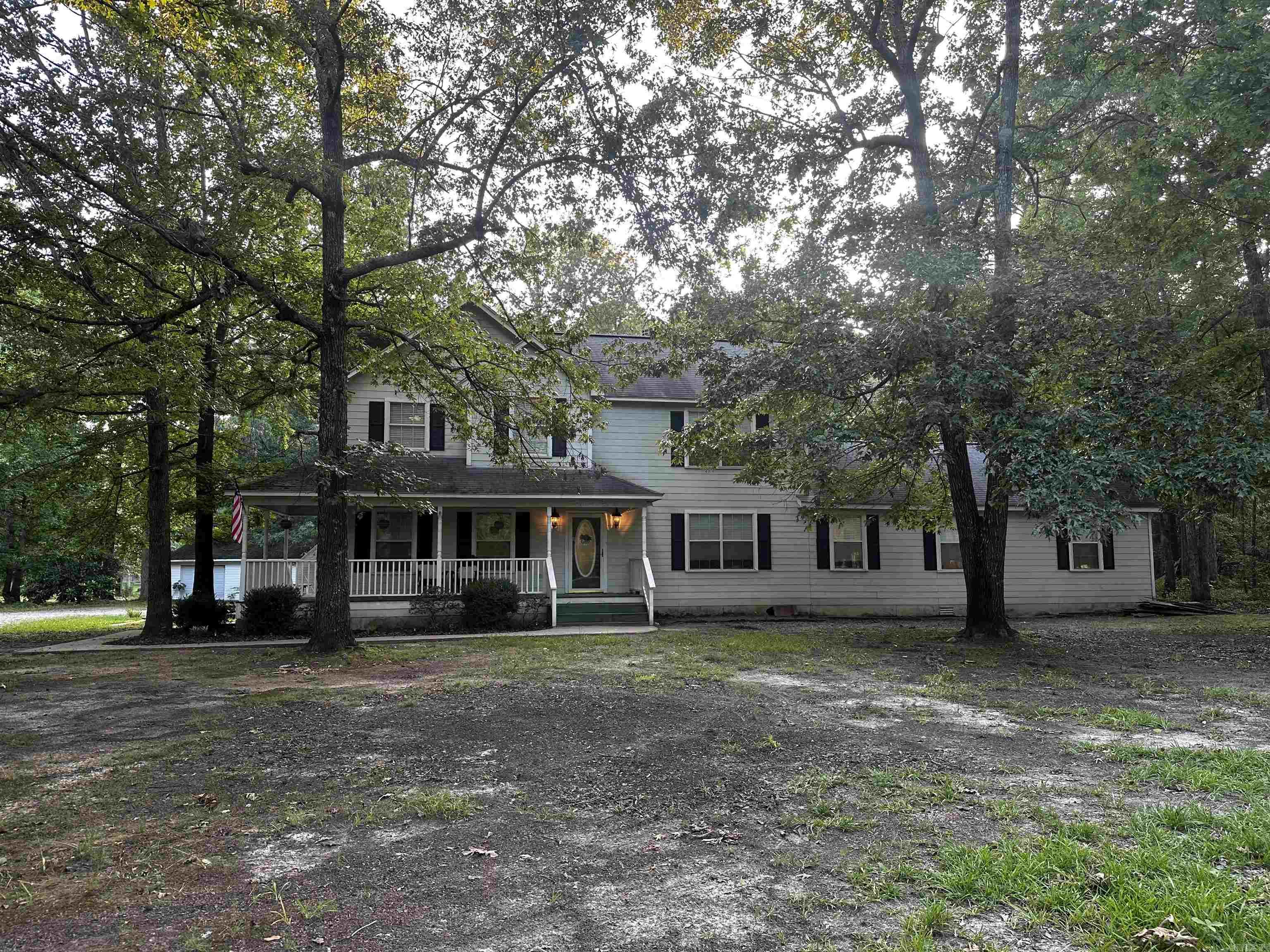 Large farmhouse on over 3 acres located at the end of a quiet street. Luxury vinyl plank flooring has been added the home to compliment the original hardwood floors. New paint and light fixtures give the house a fresh look. The primary bedroom include a full bath with whirlpool tub, separate shower, and walk-in closet. The home has an addition that includes a spacious family room, full bathroom, bedroom and laundry room. Upstairs has a large landing area, 3 more bedrooms, full bath, and 2 walk in attic spaces. The house also has a separate 2 car garage, in ground pool and pool house!! This house is ready for your family's personal touches to make it a home.