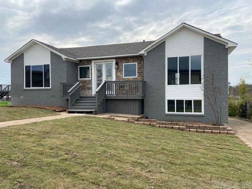 BIG PRICE REDUCTION $10,000!Tornado remodel.  New everything. Roof, HVAC, Hot Water Heater, electrical, plumbing,kitchen cabinets, granite counter tops, appliances, light fixtures, deck, interior/exterior paint, complete remodel on "3" Bathrooms. 2 Primary bedrooms. One up and one down. Downstairs could be a den/office, in-law living, amazing bathroom + closet + small office, new garage door w/openers, work shop off of garage, back loading garage, new landscaping, new deck, new windows, new dbl front door/sliding door to deck, vaulted living area opens up to a knockout kitchen and dining room.  You just have to come see to believe. The neighborhood is in the process of new/remodels on this street.  Sooo convenient to everything.