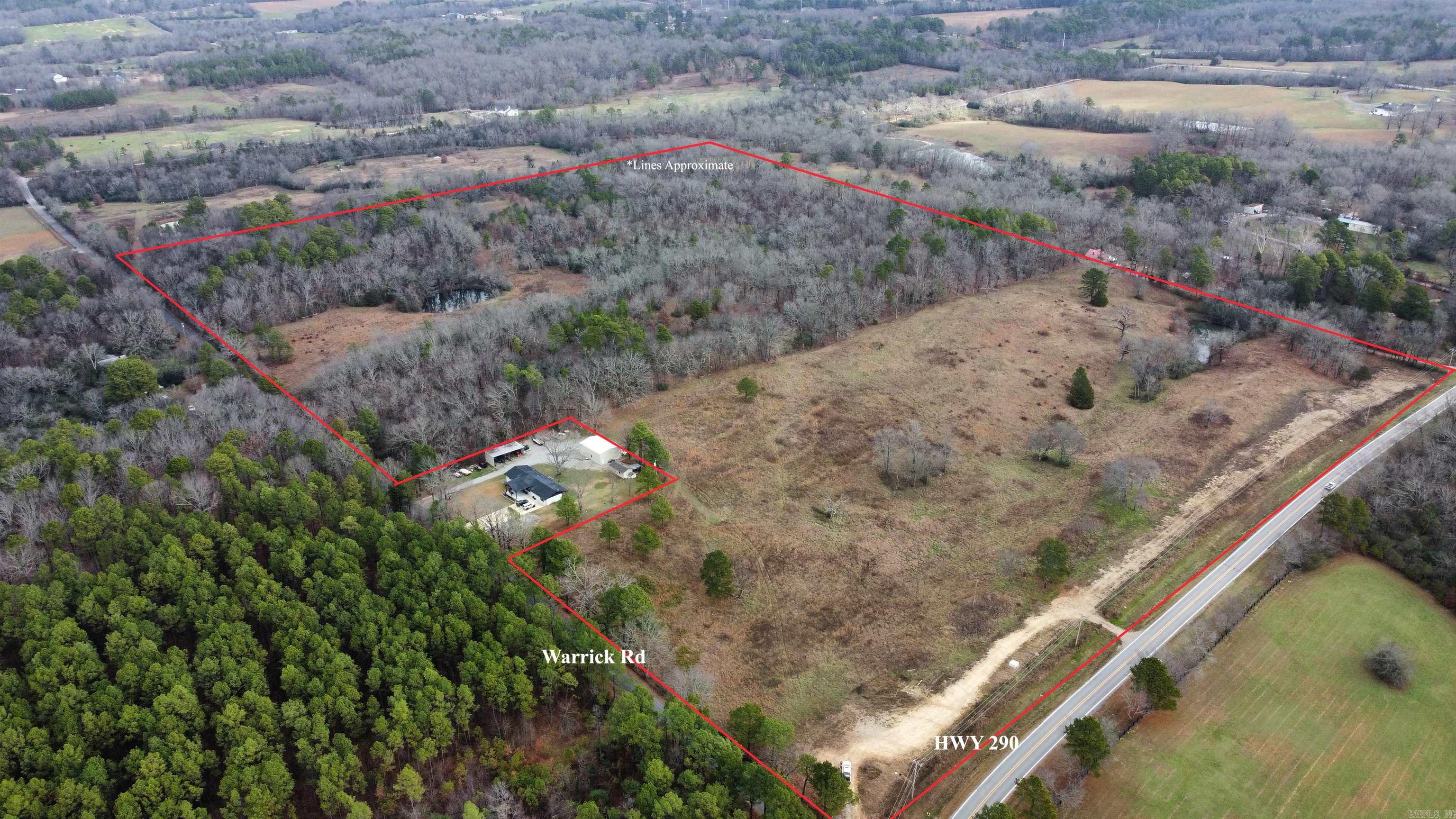Located at the corner of Hwy 290 and Warrick Rd on the south side of Hot springs, Ar, this 57.81 +/- acre property has everything one needs to build thier dream home. The landscape has a beautiful mix of open pasture and timberland, providing a peaceful retreat and a great environment for relaxation and outdoor enjoyment. There are two private ponds on the property which offer fishing and irrigation oppurtunites. The combination of ponds, dense woods, and open fields creates an ideal setting for a private residence or vacation retreat. This property could easily support a working farm or livestock operation. The pastureland offers grazing opportunities, while the timber provides potential for income.