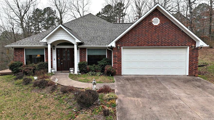 Brick Home on 18.25 Wooded Acres Near Mena.  Escape to space, privacy, and comfort with this beautiful 3-bedroom, 2-bath brick home set on 18.25 wooded acres with scenic vista views. Located on a paved road just minutes from Mena. Inside, you’ll find both a living room and a spacious great room featuring a gas fireplace, ideal for relaxing or entertaining. The large kitchen includes a breakfast bar, ample cabinetry, and a pantry, and is complemented by a formal dining room for gatherings and special occasions. The main bedroom suite is generously sized and includes a luxurious bath with double vanities, a separate jetted tub, a walk-in shower, and a large closet. Big windows throughout the home bring in natural light and showcase the beautiful surrounding views. Enjoy the outdoors from the front porch or side deck, perfect for taking in the peaceful setting. Additional features include an oversized attached garage, a HVAC system, an 18' x 24' metal storage shed, and the peace of mind of a 24KW whole-home generator. This property is ideal for those seeking privacy, comfort, and room to roam, all just a short drive from town.