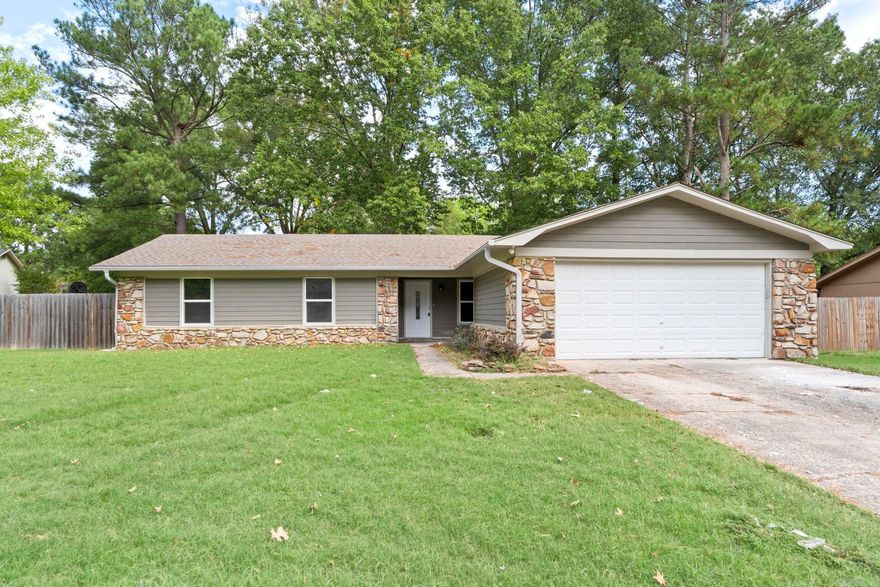 Remodeled 3 bedroom and 2.5 baths home with 2 car garage in a great Conway location! Quiet neighborhood close to restaurants and shopping. NEW kitchen & baths! NEW flooring, paint, appliances, and fixtures. Large utility room off of the kitchen offers garage entry and a half bath. TWO living spaces, one with a timeless stone fireplace. The remodeled kitchen is so bright and airy! The primary suite has a beautifully remodeled private bath and large walk in closet. The hall bath is also remodeled and quite roomy! Large patio perfect for entertaining and a big, fenced backyard. Be sure to see the floorplan in the photos. No seller property disclosure.
