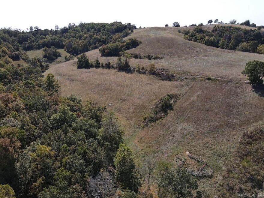 Check out this gem of a property in the heart of the Ozarks with rolling terrain, stunning views, and high-quality fencing. Located just outside the community of Pyatt, AR, this wonderful tract is prime for that ideal building site with vista scenic views to the north and east. Fronting the small, paved country highway, the access is phenomenal, and utilities are very close by. The property sports some excellent character with small rock outcroppings, a small one-room cave, established fescue and Bermuda grasses, one pond, newer 7-strand barb wire fencing, a small working pen, and 2 small springs! Very little is to be desired on this beautiful land. The rolling terrain lends itself to not only great views but also privacy and ample spots to build or even hunt. The vantage points are endless, and the population of whitetail deer and turkey are very healthy and numerous. Some small ravines travel through the land and offer larger timber, ample cover, and more character. You could hike, camp, hunt, or do a number of outdoor activities. Literally less than 1 mile to groceries and essentials, the location is prime for anyone looking to settle down.