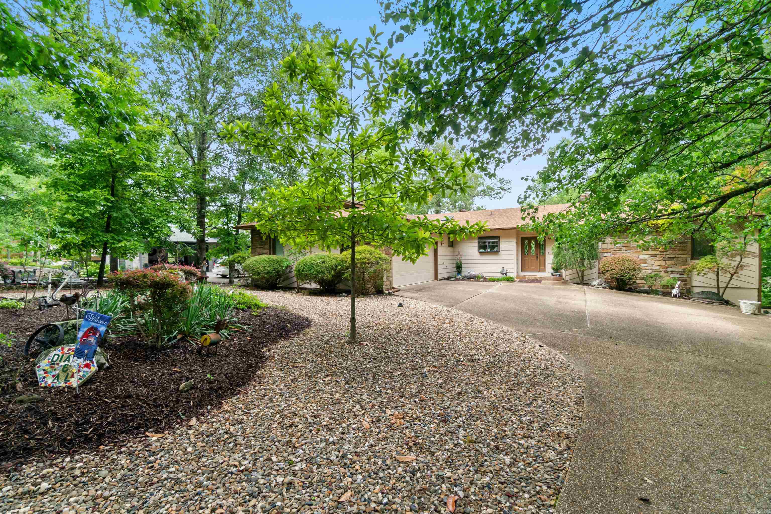 Beautiful Coronado Lake Home - Let's go fishing! Or, maybe play pickle ball? There's a court! Covered boat traffic protected dock. Gentle to lake/dock, and level driveway. There's also house room for about every pursuit you wish - Lower level has large shop, large quilting, sewing or multi-purpose room, appropriate media room, bedroom & two baths. Entry level has 3 bedrooms & 2 baths, unheated screen porch/sunroom. Roof and HVAC unit recently replaced. Call today for your private showing! SEE AGENT REMARKS