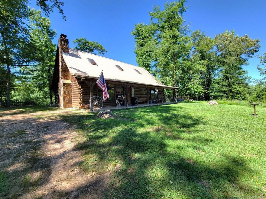 Looking for a peaceful place on 10 acres? Beautiful 3 bedroom, 2 bath log home with 2 porches, balcony off the main bedroom and a metal roof. The great room has vaulted ceiling, wood burning fireplace and the home has skylights offering natural light through-out. This home has central heat and air, well, and septic. Outside there is a 2000 square foot shop building with with slab floor and electricity. If you are looking for home in the country this is a must see!