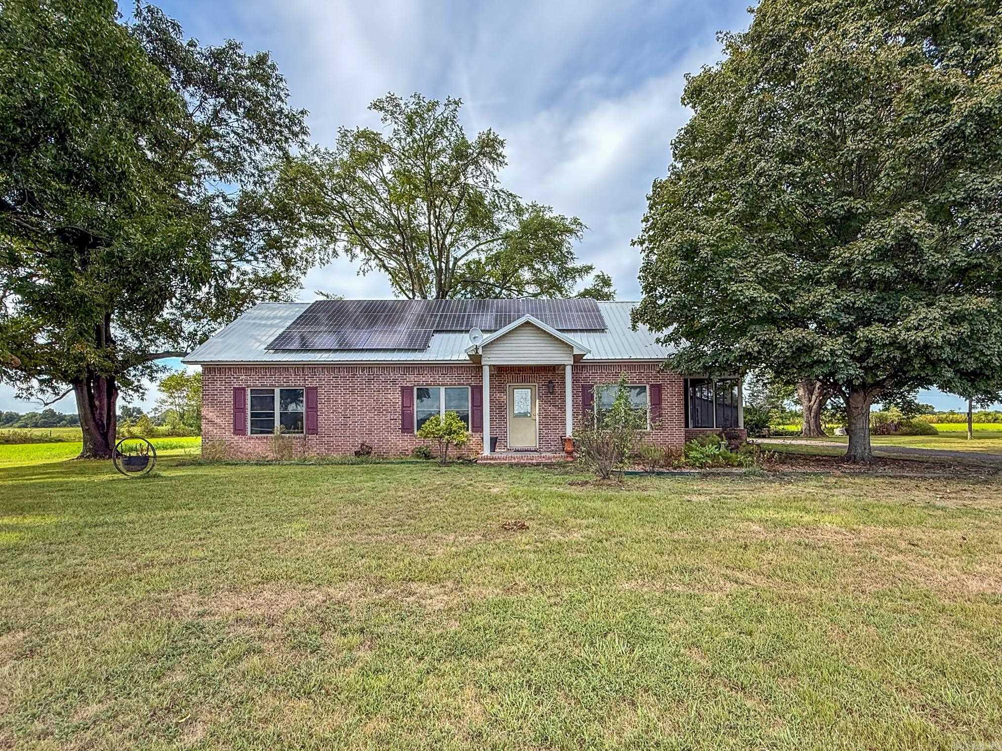 Beautiful home in the heart of the country. Metal roof, Solar panels (Paid Off), Double oven, solid surface counter tops and great stained cabinets. Big living room with hard wood floors. Master bedroom has pan ceiling and walk in shower. Laundry room/ office. Screened in porch. All of this on 5 acres. You are going to love this! Call today!