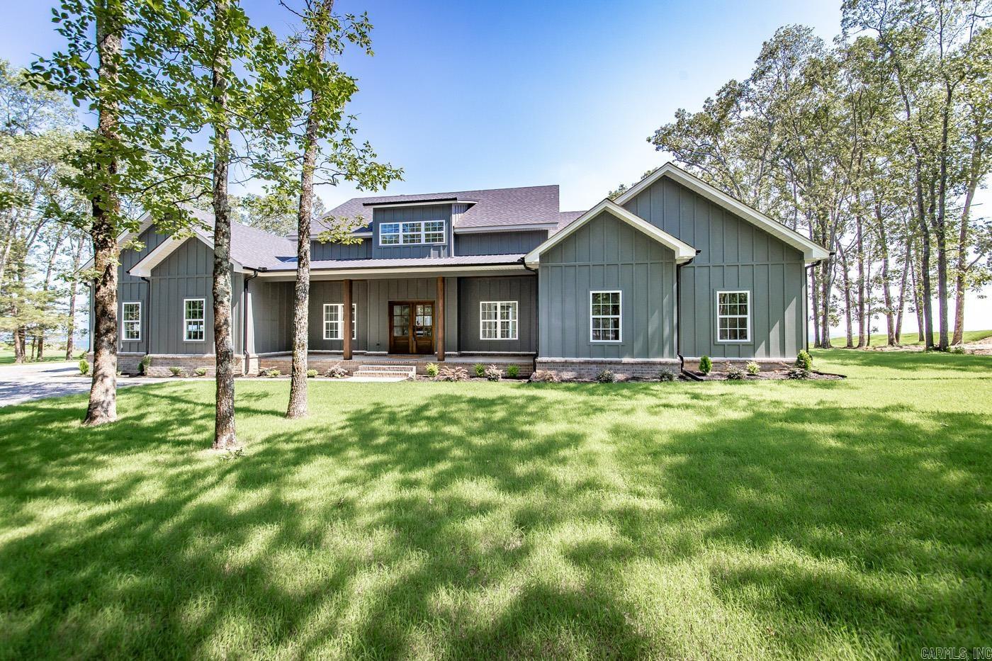 This beautiful 4/3.5 3050 sq ft. new construction luxury home has magnificent lake views that you will be enjoying year-round. Peaceful and serene, this home sits on a 3-acre lot that is surrounded by beautiful mature trees. As you walk through the front door you will be greeted with breath taking views that overlooks the Narrows with panoramic views from Sugarloaf Island to Eden Isle. All on Greers Ferry Lake. A beautiful, large outdoor entertaining area with deck, fireplace and cooking grill has been added for hours of enjoyment. Enjoy this home's open floor plan with fireplace and beautiful masonry features that were thoughtfully added to the inside of this home. Beautiful custom kitchen cabinets with granite countertops and a large walk-in pantry. Master has a large custom-built closet and beautiful tile work in bath. Wake up each morning in paradise! See Agent Remarks!