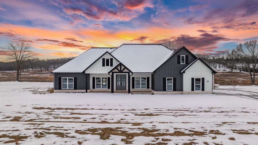 Custom Build with a great view from the vaulted back porch. The windows at the back of this house are gorgeous. If you like light you will love this. They look out onto the big vaulted back porch with tongue and groove wood celings. The front porch has tongue and groove as well. Beautiful real limestone gas fireplace with a hearth. The kitchen has a huge island and cabinets to the ceiling. Amazing amount of storage in the cabinets not to mention the hall walk in pantry. The doorways in the home are wider for handicap access and the interior doors are all solid. Oversized shower in the primary bathroom with double vanities, soaking tub and private water closet. Third car garage has extra depth for a trailer, boat or extended truck.
