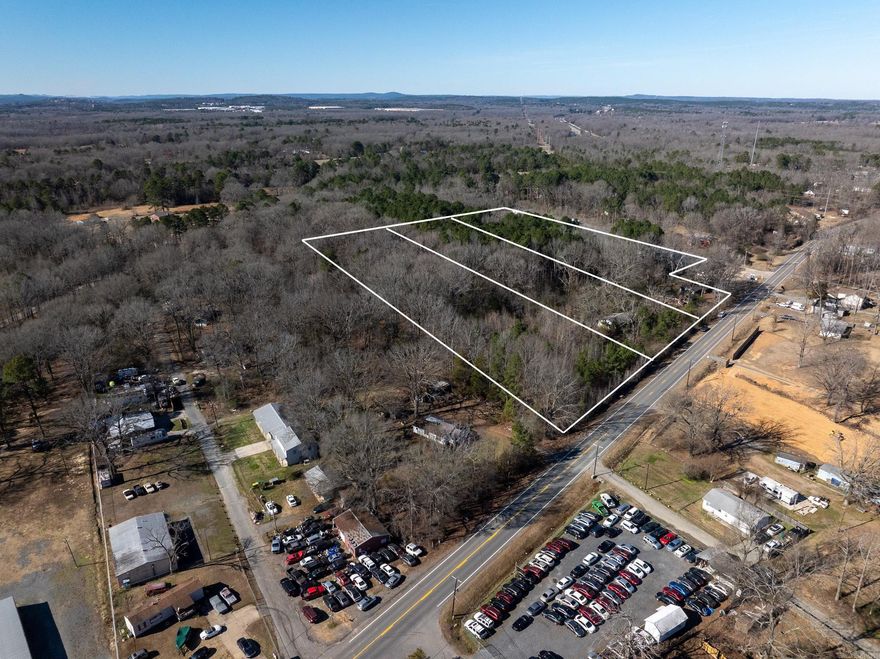 This 4.9-acre tract is ideally located along MacArthur Drive in the North Little Rock area of Pulaski County, offering both accessibility and natural features that are increasingly hard to find this close to town. Utilities are available at the road, making this property well-suited for residential, recreational, or small-scale development use.  The land features a mix of mature and smaller timber, providing privacy, shade, and flexibility for clearing while maintaining a natural setting. Multiple strong building sites are present across the property, allowing for a variety of layout options. A creek runs through the land, adding character and appeal for those looking for a scenic homesite or recreational retreat.  With road frontage, utilities nearby, and a combination of buildable ground and natural features, this tract offers an excellent opportunity for buyers seeking acreage in a convenient North Little Rock location with long-term value and versatility.