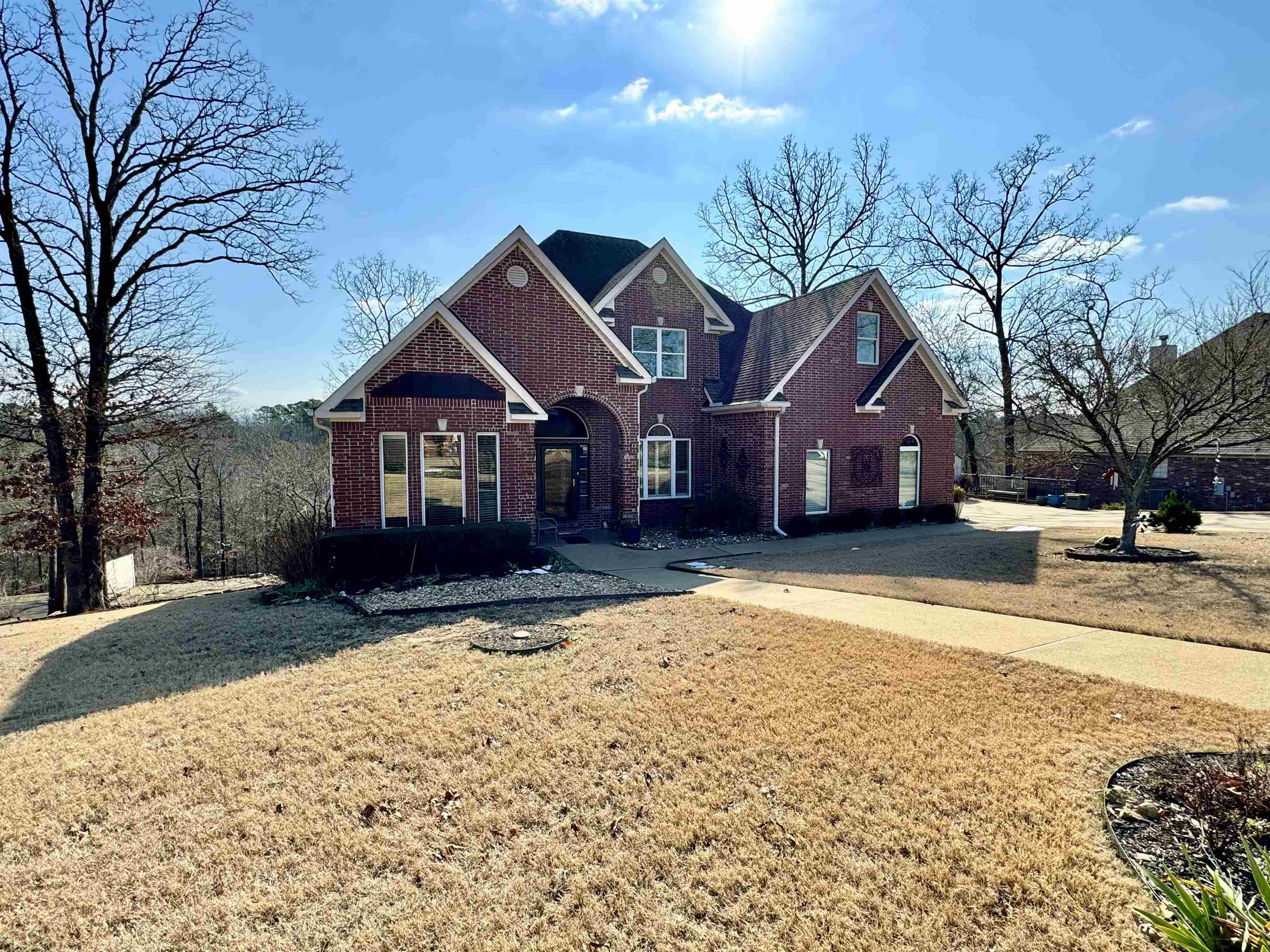 Welcome to this beautifully updated 5-bedroom, 3-bathroom home, offering luxurious living spaces, contemporary finishes, and a fantastic layout that caters to both family living and entertaining. Located in the highly desirable Deanwood Heights Subdivision, this home is designed for comfort, convenience, and style. Upon entry, youāll be greeted by a spacious formal dining room, perfect for hosting dinner parties or enjoying family meals. The heart of the home is the updated kitchen, featuring gorgeous granite countertops, a gas range, double wall ovens, and ample cabinetryāideal for the home chef. The kitchen opens seamlessly into the living room, where a striking high fireplace with gas logs creates a cozy yet elegant focal point, perfect for gatherings or quiet evenings. Adjacent to the living room, an inviting heated and cooled all-seasons room provides year-round enjoyment, whether you're relaxing with a book or entertaining guests. Two separate decks across the back of the home offer excellent outdoor living space, perfect for dining, lounging, or enjoying the outdoors in privacy. The main floor features a generous primary suite, which includes a beautifully designed ensuite.