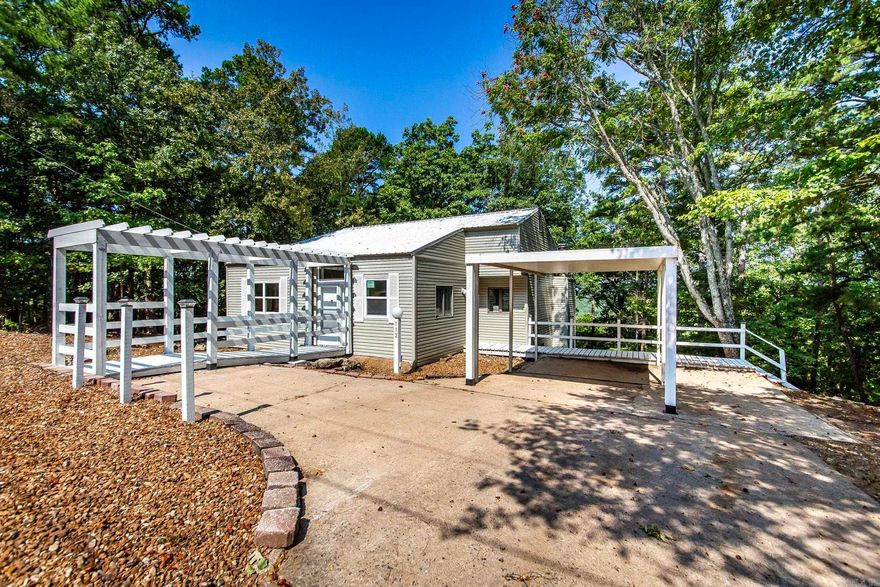 Welcome home in the serene & scenic community of Fairfield Bay, Arkansas! Nestled on a tranquil street where neighbors take leisurely walks & savor the surrounding beauty, this delightful residence offers a perfect blend of comfort & convenience. Just a short 10-minute drive will take you to the stunning Greers Ferry Lake & the beautifully manicured Indian Hills Golf Course & Mountain Ranch Golf Course. Inside, this charming home has undergone recent upgrades to ensure modern living at its finest. Revel in the energy efficiency & bright ambience provided by LED lighting throughout the house. The new deck offers a serene spot to relax & take in the natural beauty of the Bay. The kitchen is equipped with sleek stainless steel appliances, perfect for cooking gourmet meals. Other improvements include updated toilets & luxury vinyl flooring in select areas for added elegance & easy maintenance. Stay comfortable year-round with the new heat and air system. The Bay boasts an impressive list of amenities that cater to all interests & ages, including three inviting swimming pools, a fun-filled putt-putt golf, pickle ball & tennis courts. Owner will finance for two years.  5.5% WAC